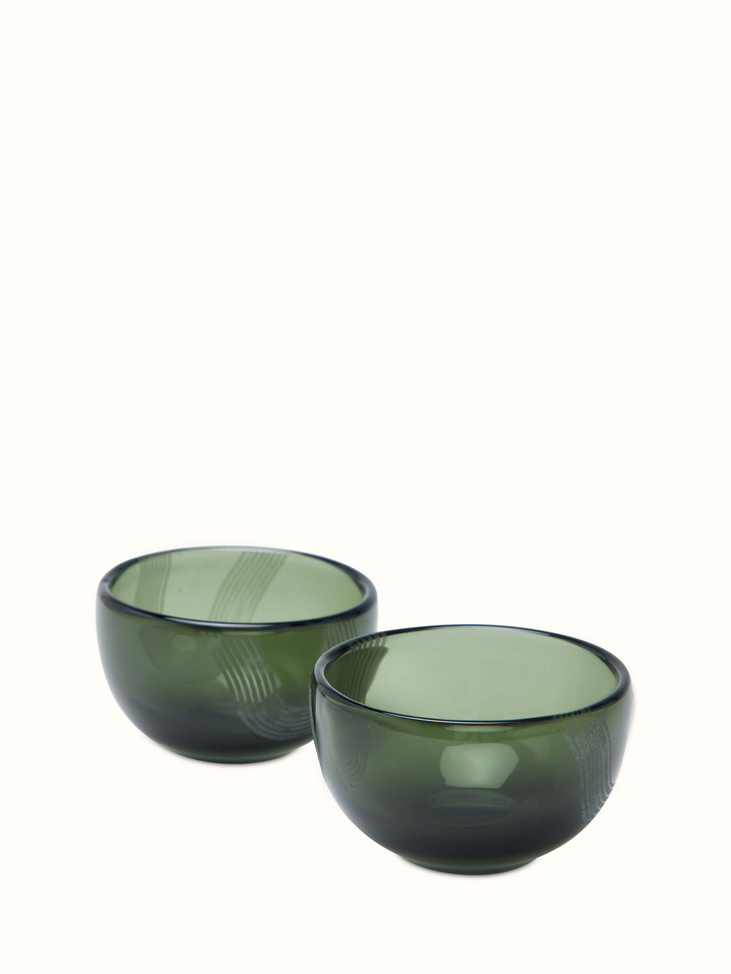 Front view of Firozabadi glass nut bowls in green, set of 2, displaying elegant glasswork