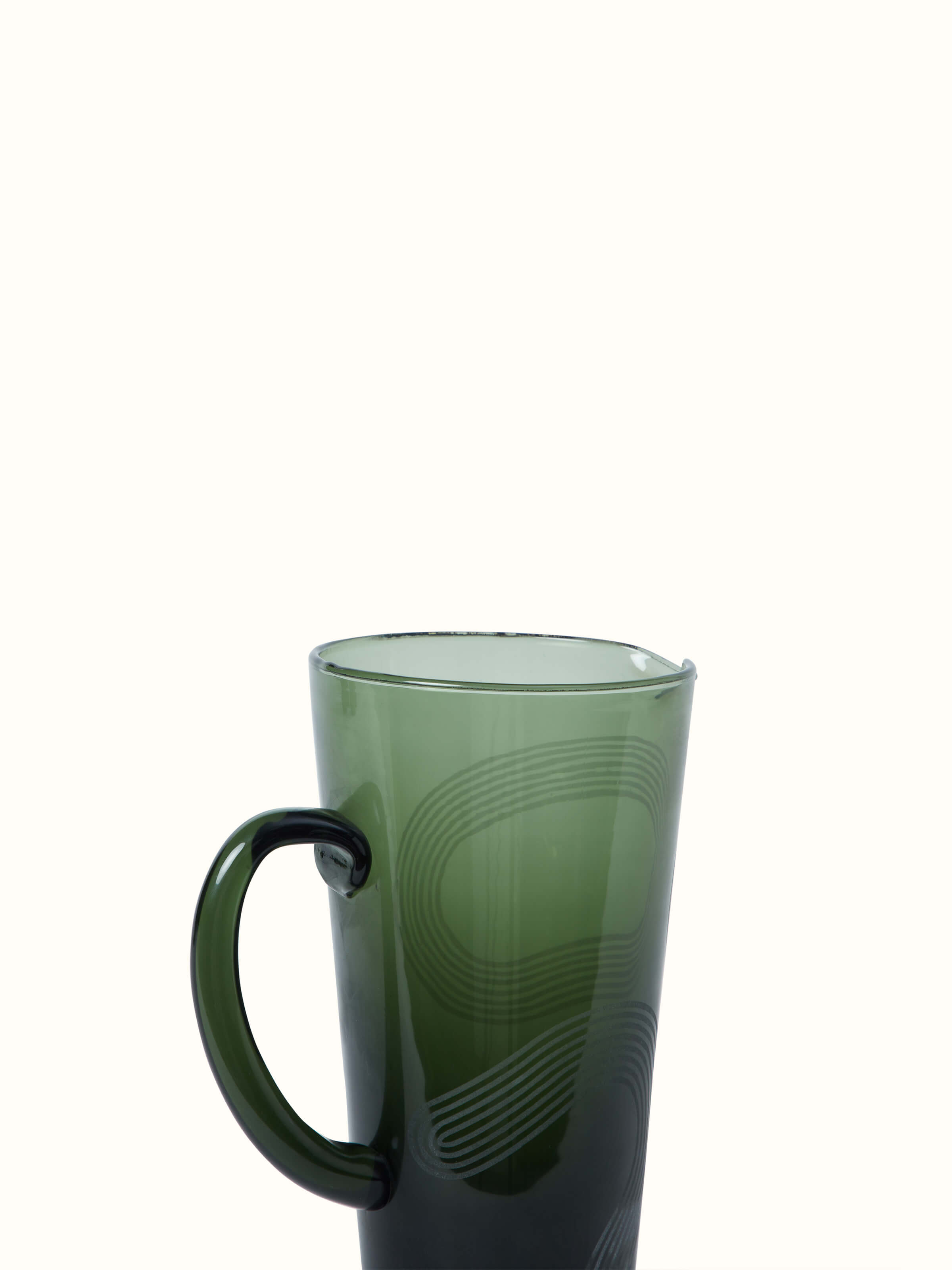 Close-up view of Firozabadi Glass Pitcher in Green, focusing on the intricate glasswork and color