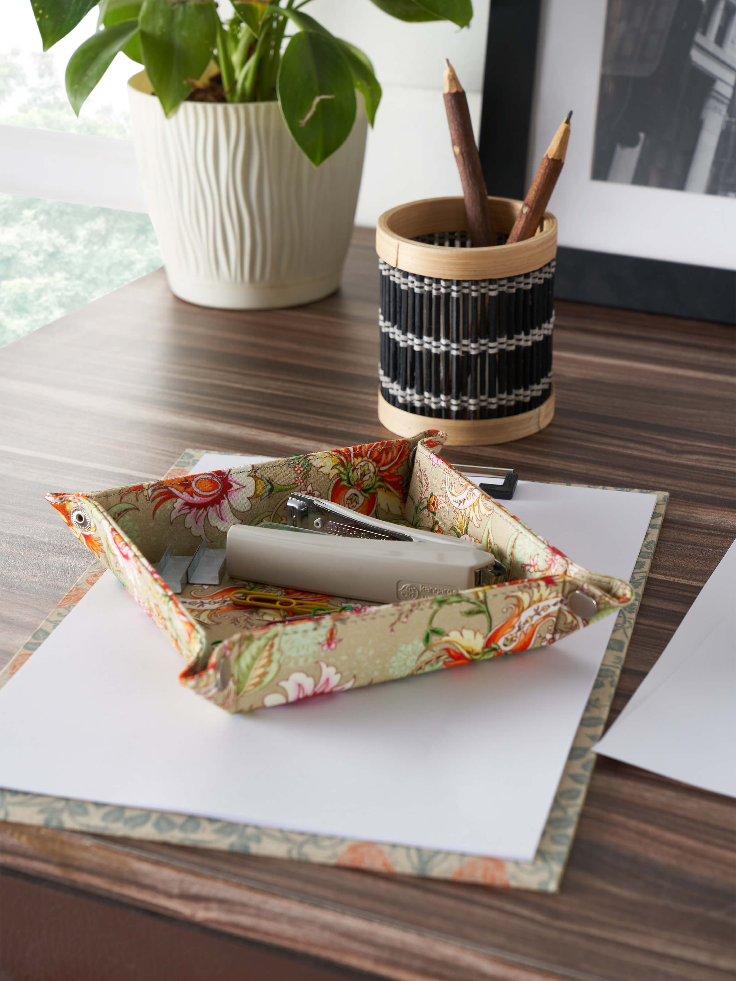 Top view of orange leather valet tray displaying its spacious compartments and sleek design