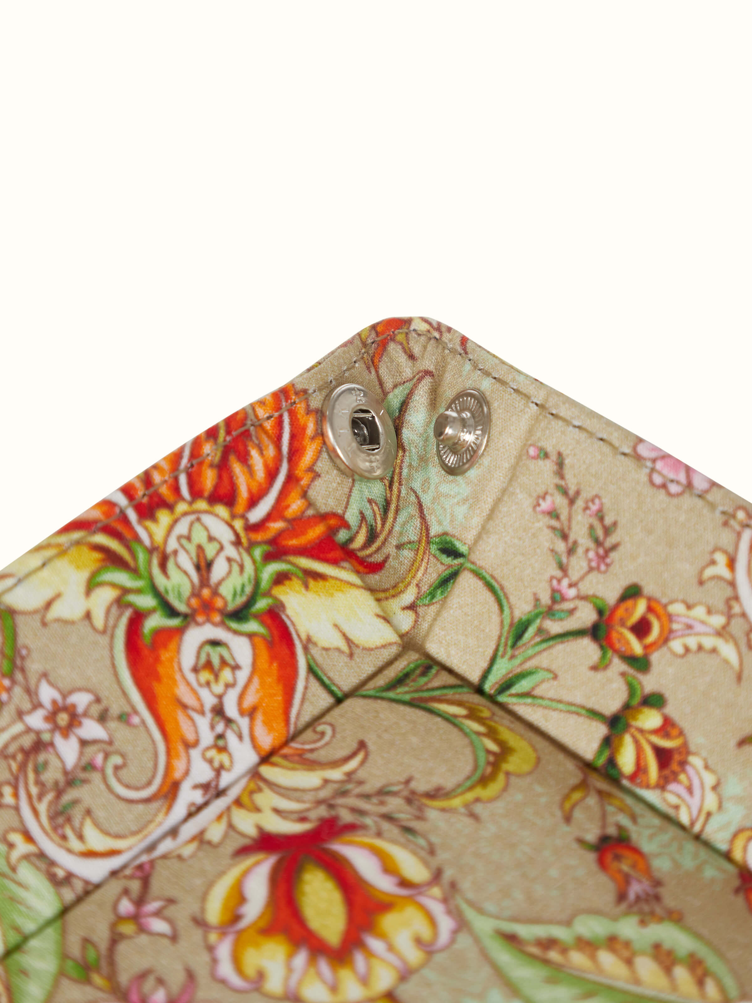 Close-up of orange leather valet tray focusing on the fine leather texture and craftsmanship