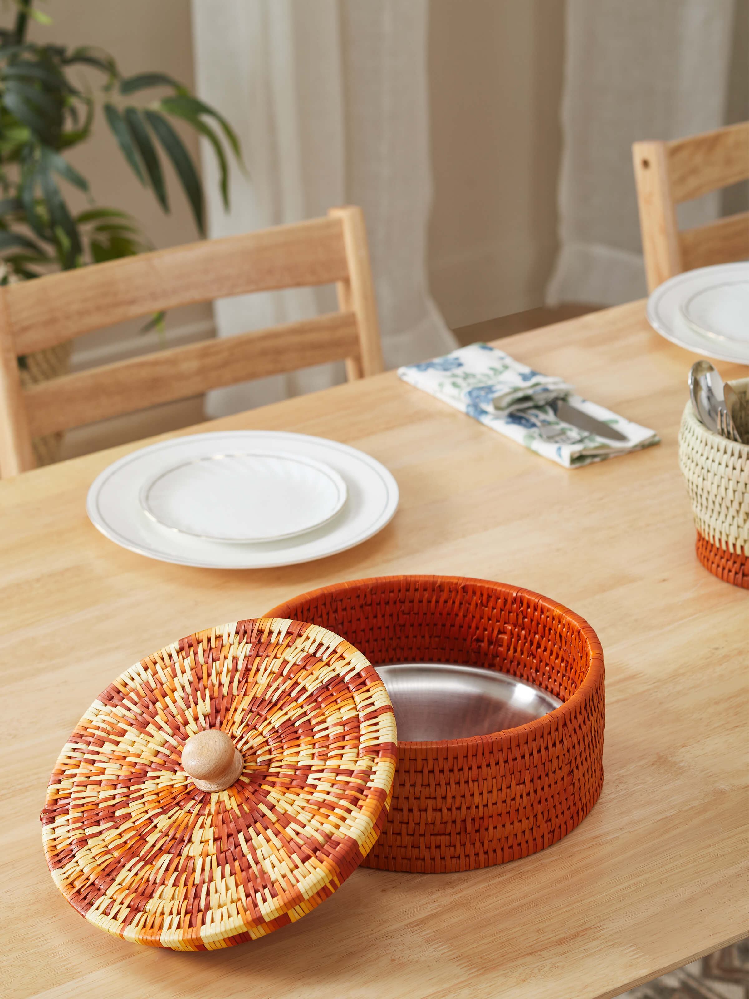 Side view of palm leaf woven roti box in brown, showcasing the sturdy construction and stylish design