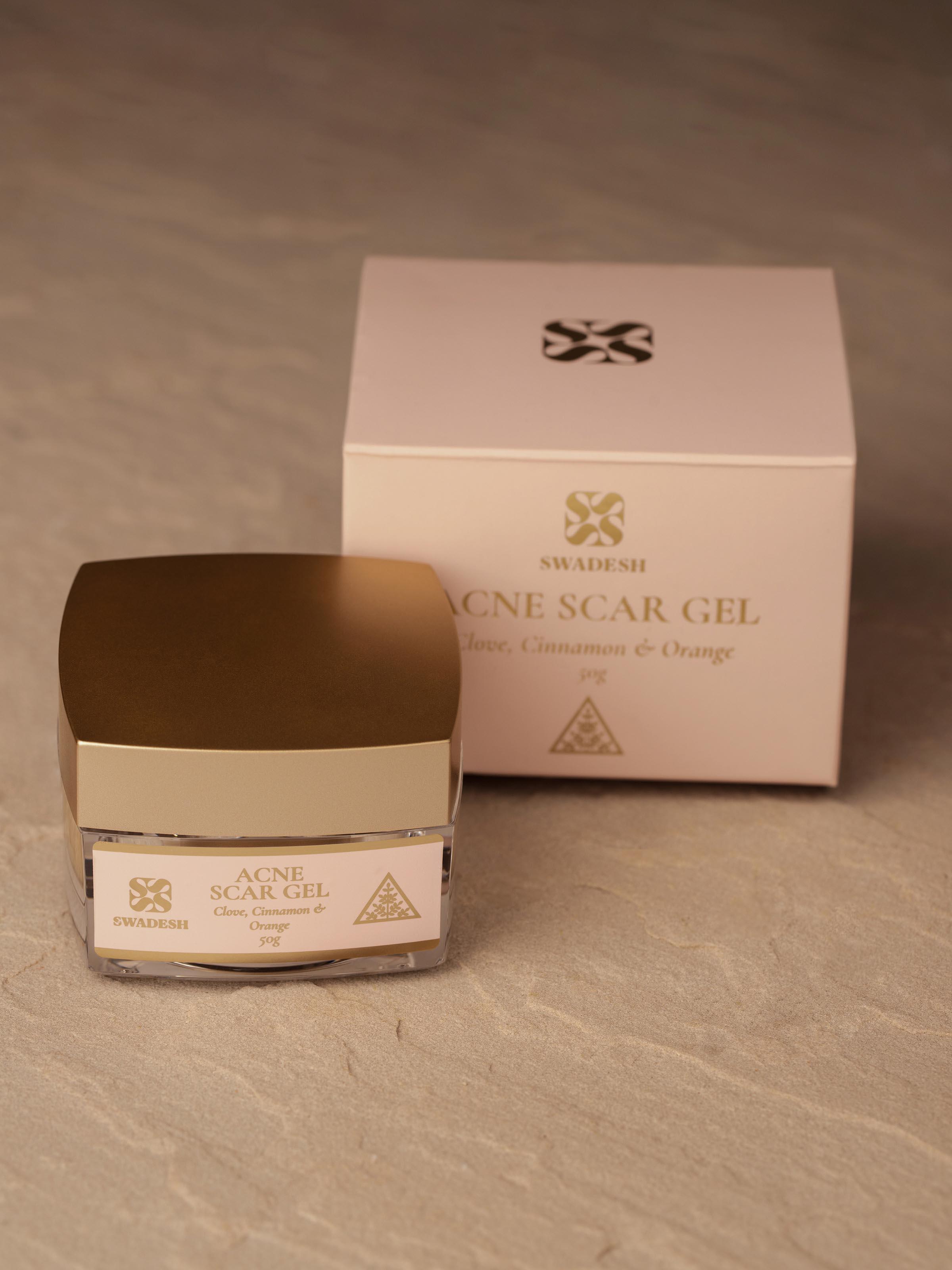 Close-up of Acne Scar Gel Clove, Cinnamon & Orange focusing on the texture of the gel and product label.