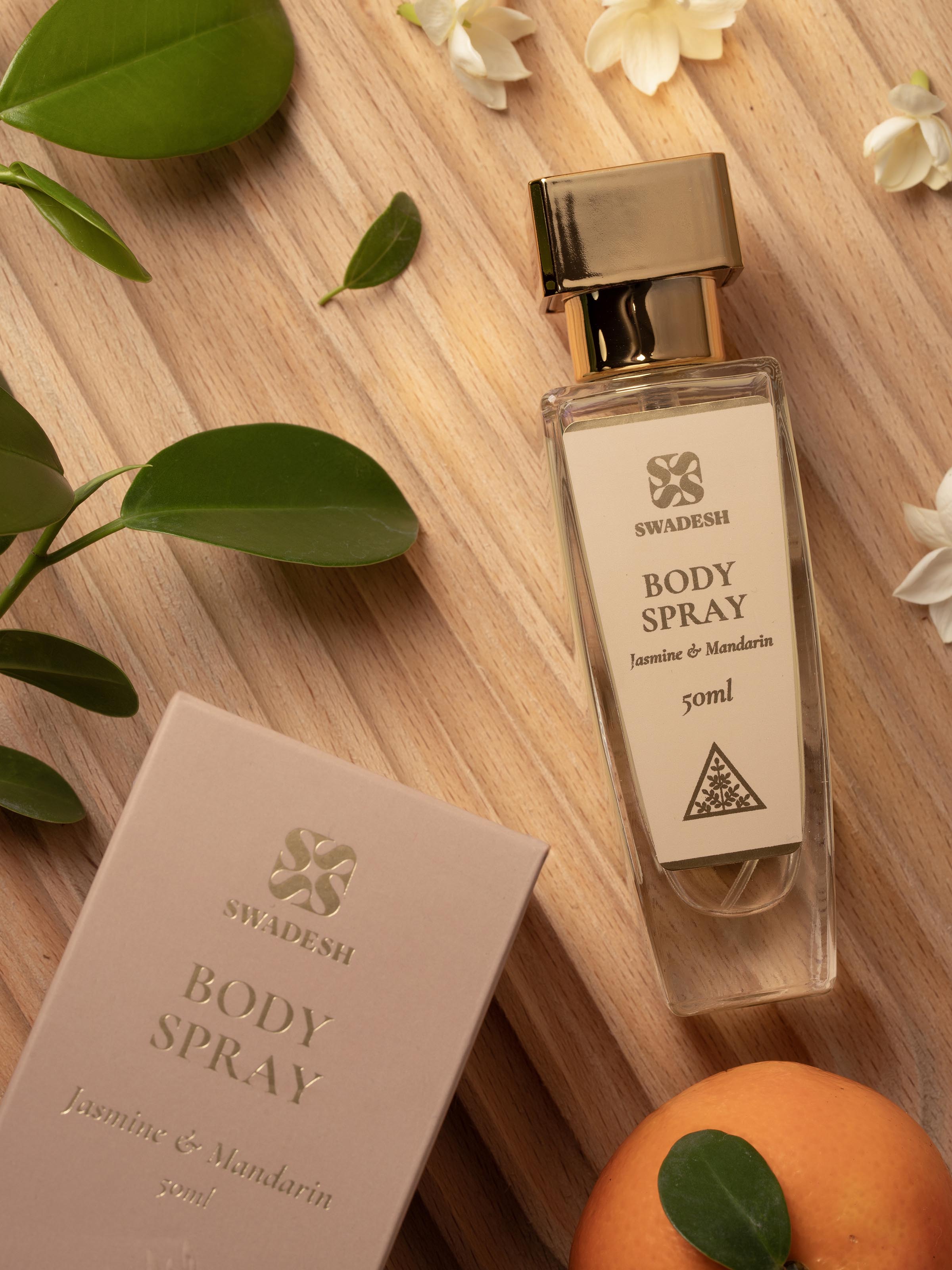 Close-up of Body Spray Jasmine & Mandarin emphasizing the fragrance label and detailed bottle design.