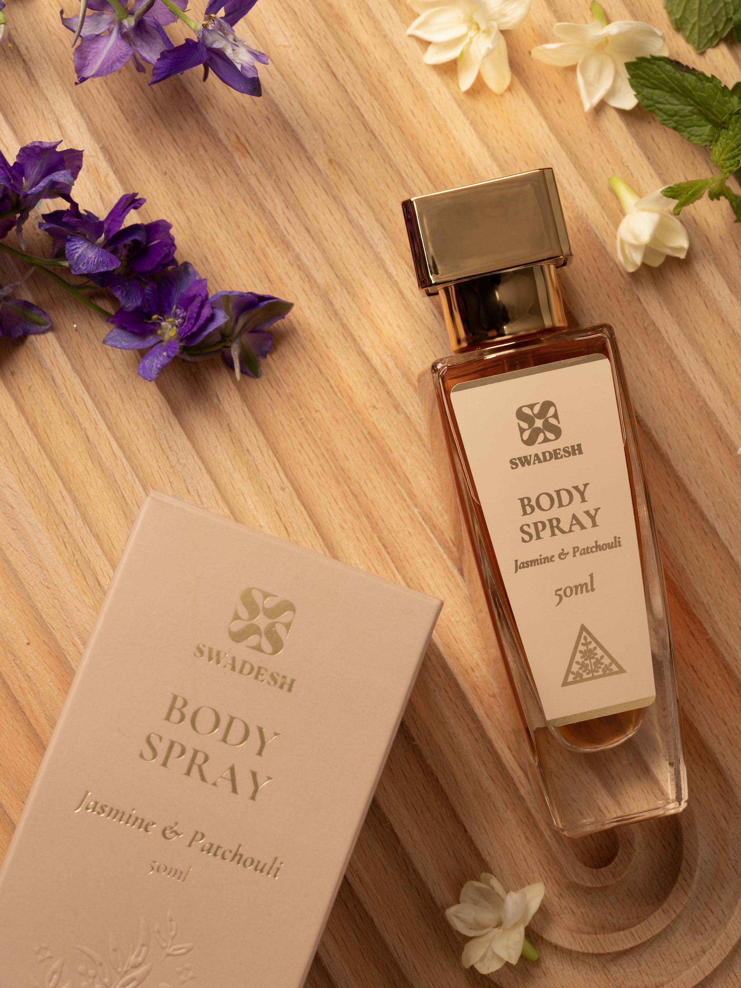 Close-up of Body Spray Jasmine & Patchouli featuring the spray bottle's cap and intricate design elements.