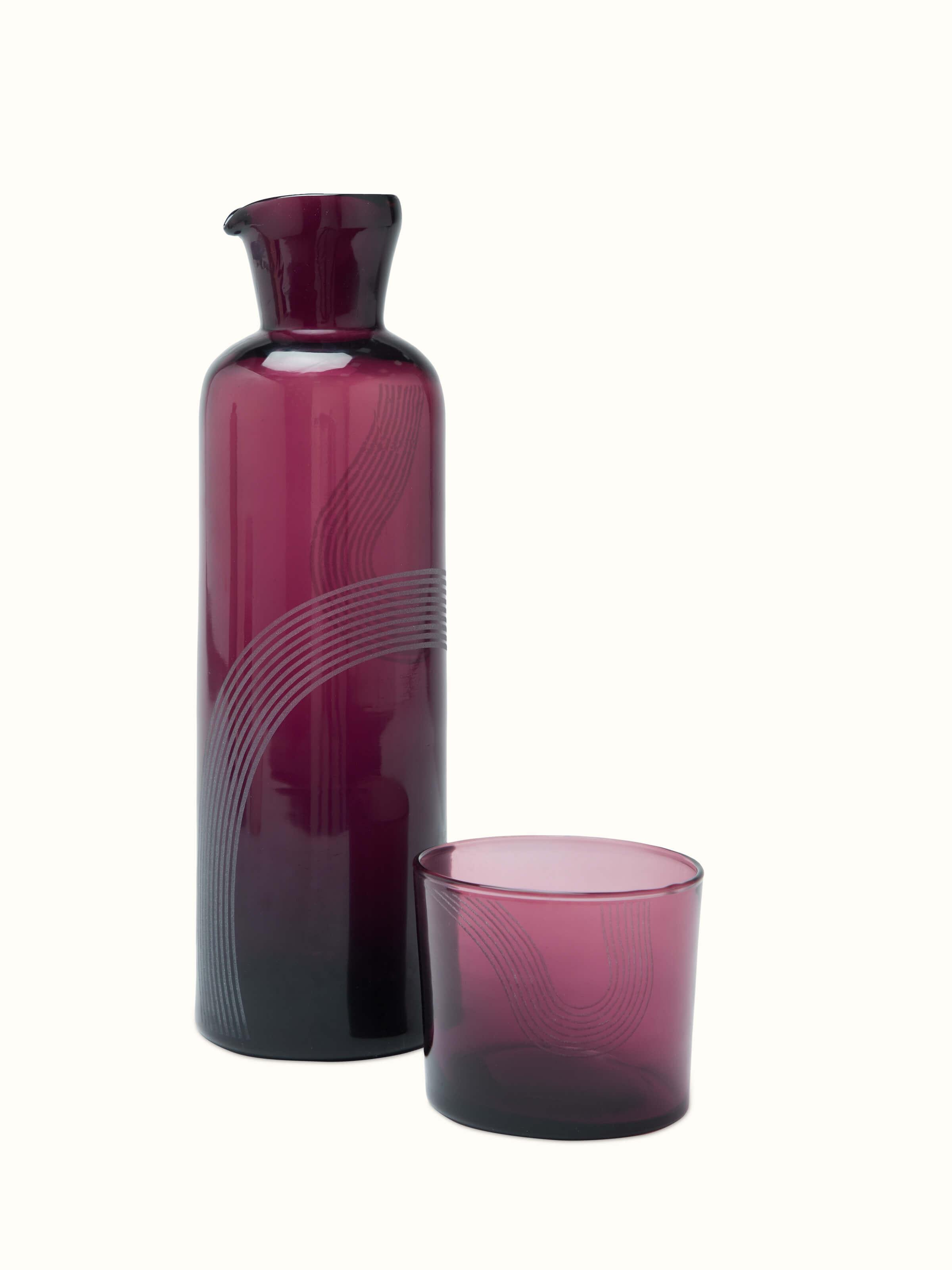 Front view of Firozabadi glass carafe in purple showcasing its elegant design and color