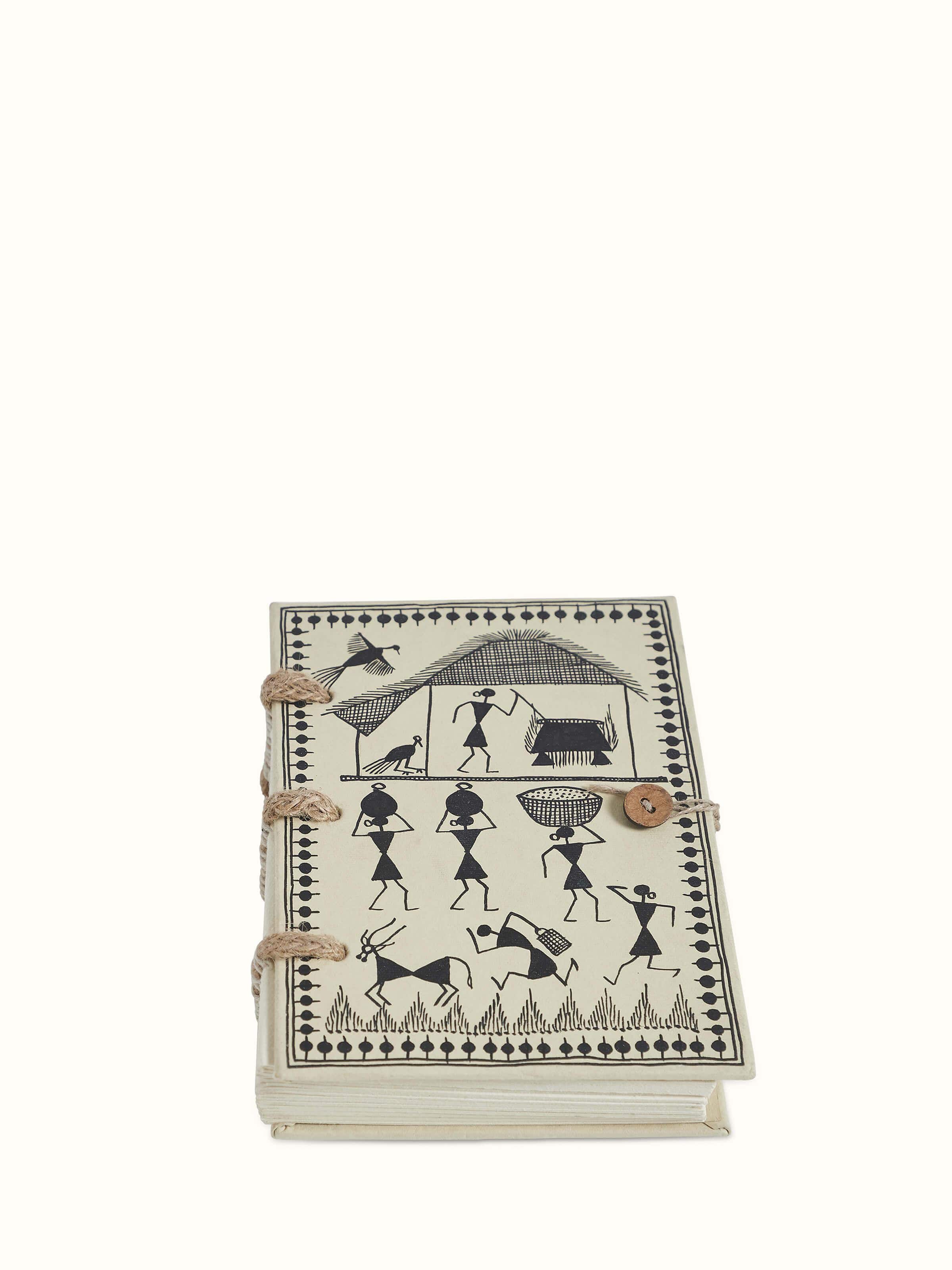 Front view of Warli painted paper planner brown showcasing its intricate Warli art design