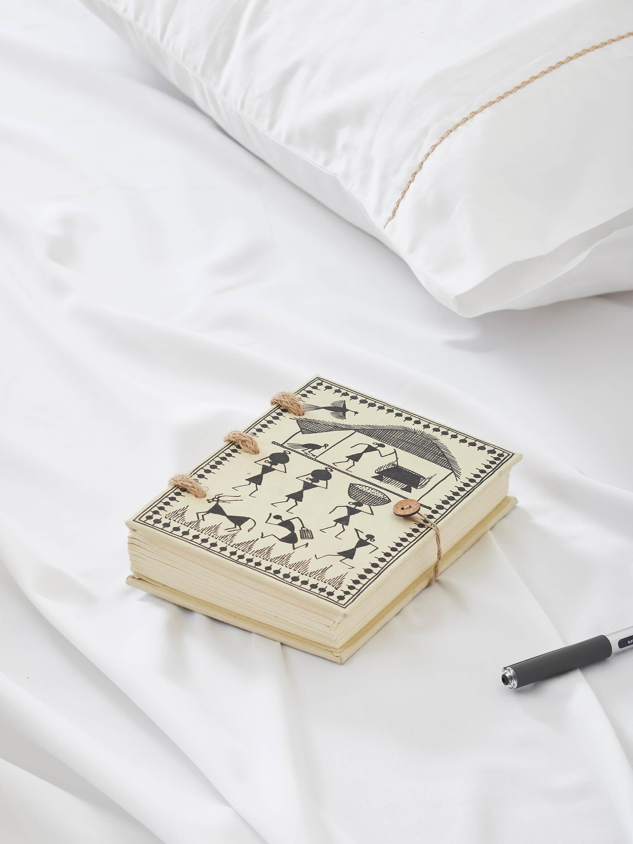 Side view of Warli painted paper planner brown highlighting its artistic design and craftsmanship