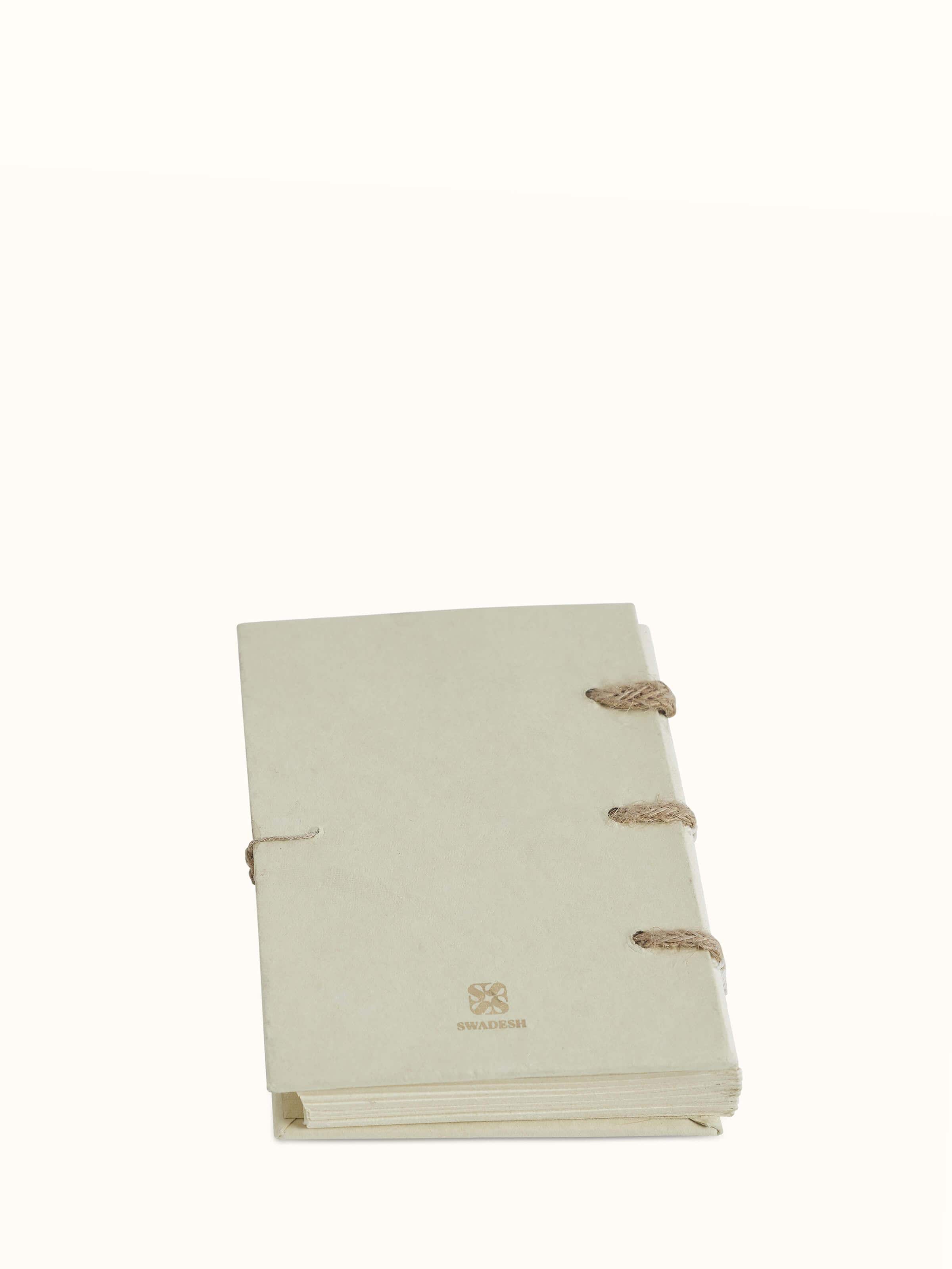 Angled view of Warli painted paper planner brown highlighting its elegant design and finish