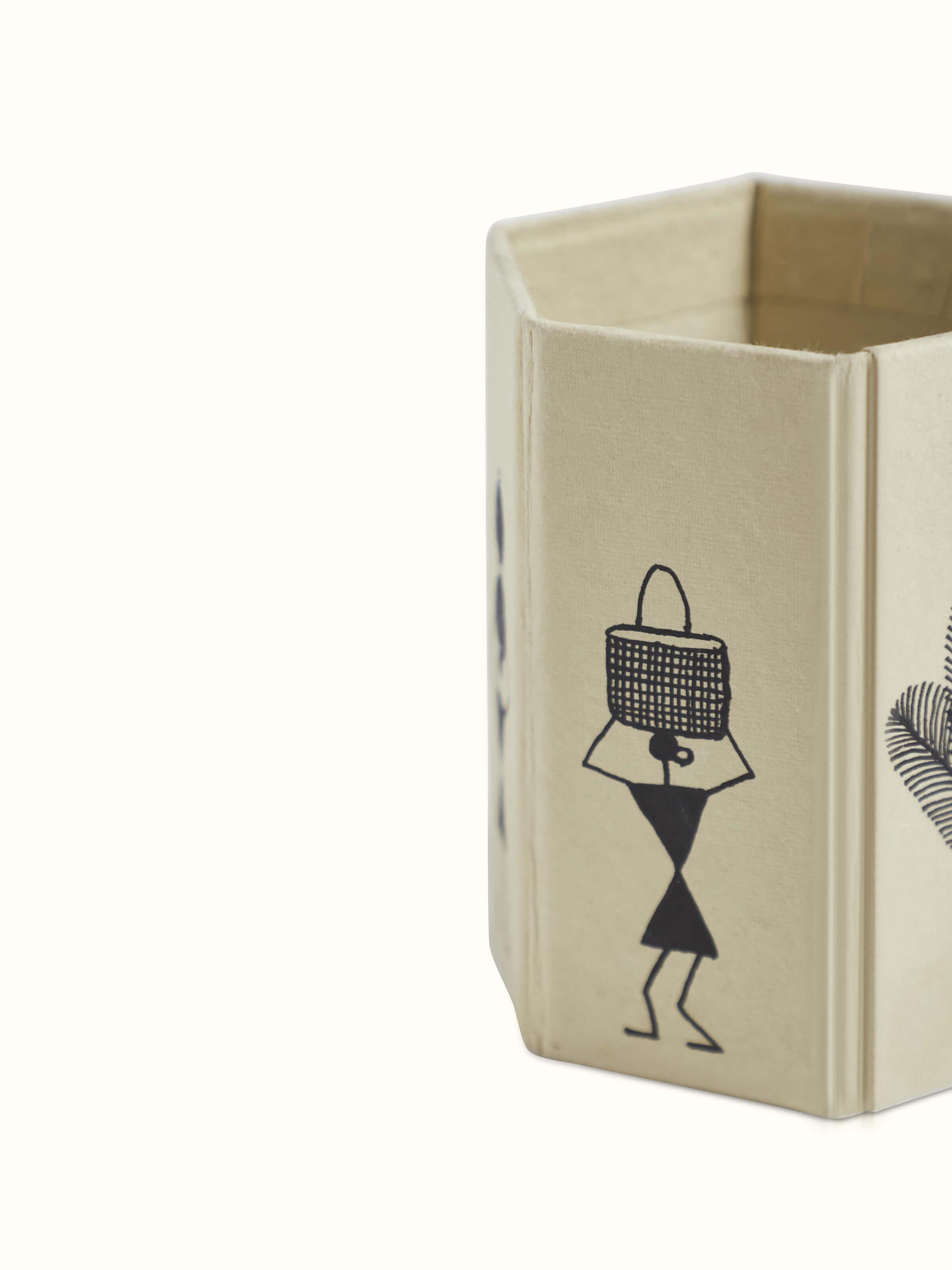 Top view of Warli Painted Paper Pen Stand in brown, showing the overall design and Warli painting details