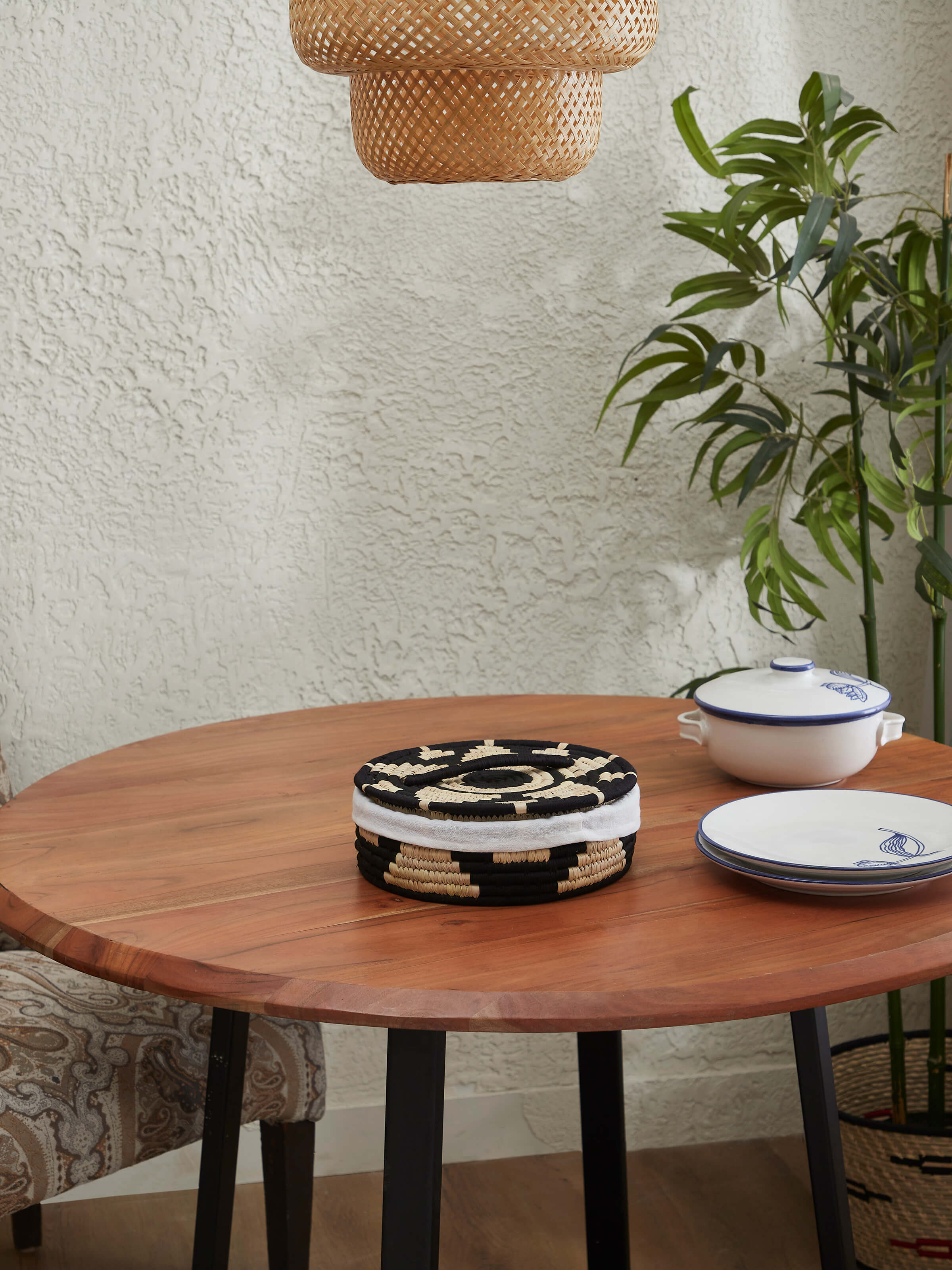 Side view of Kanshi basketry natural fibre bread basket, highlighting the intricate weave and sturdy design