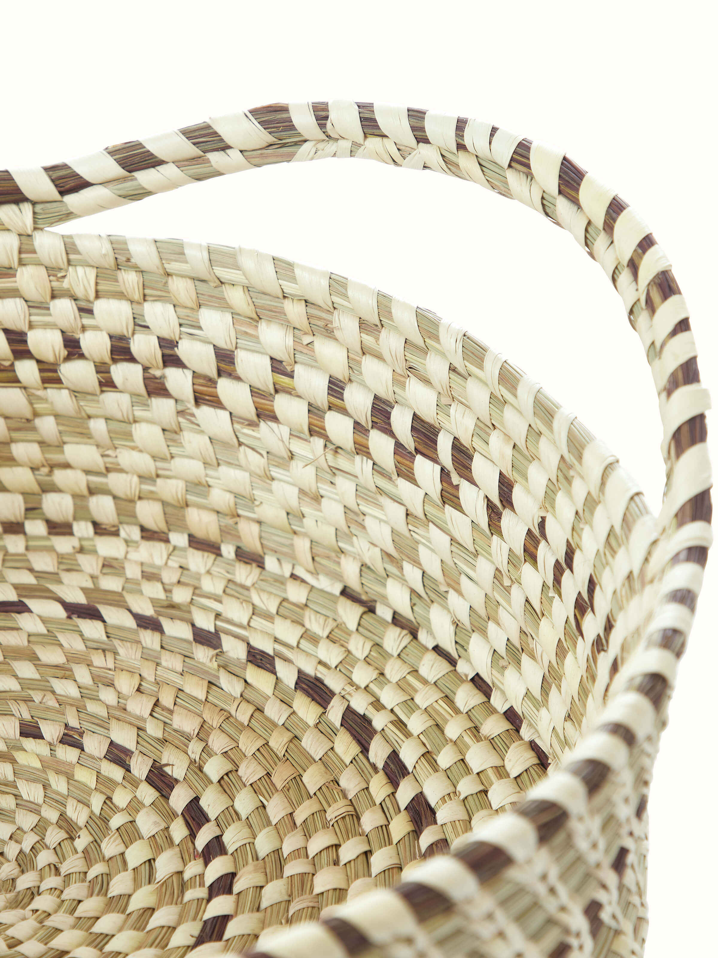 Kanshi basketry natural fibre fruit basket displayed with fruit, demonstrating its functionality and aesthetic appeal.