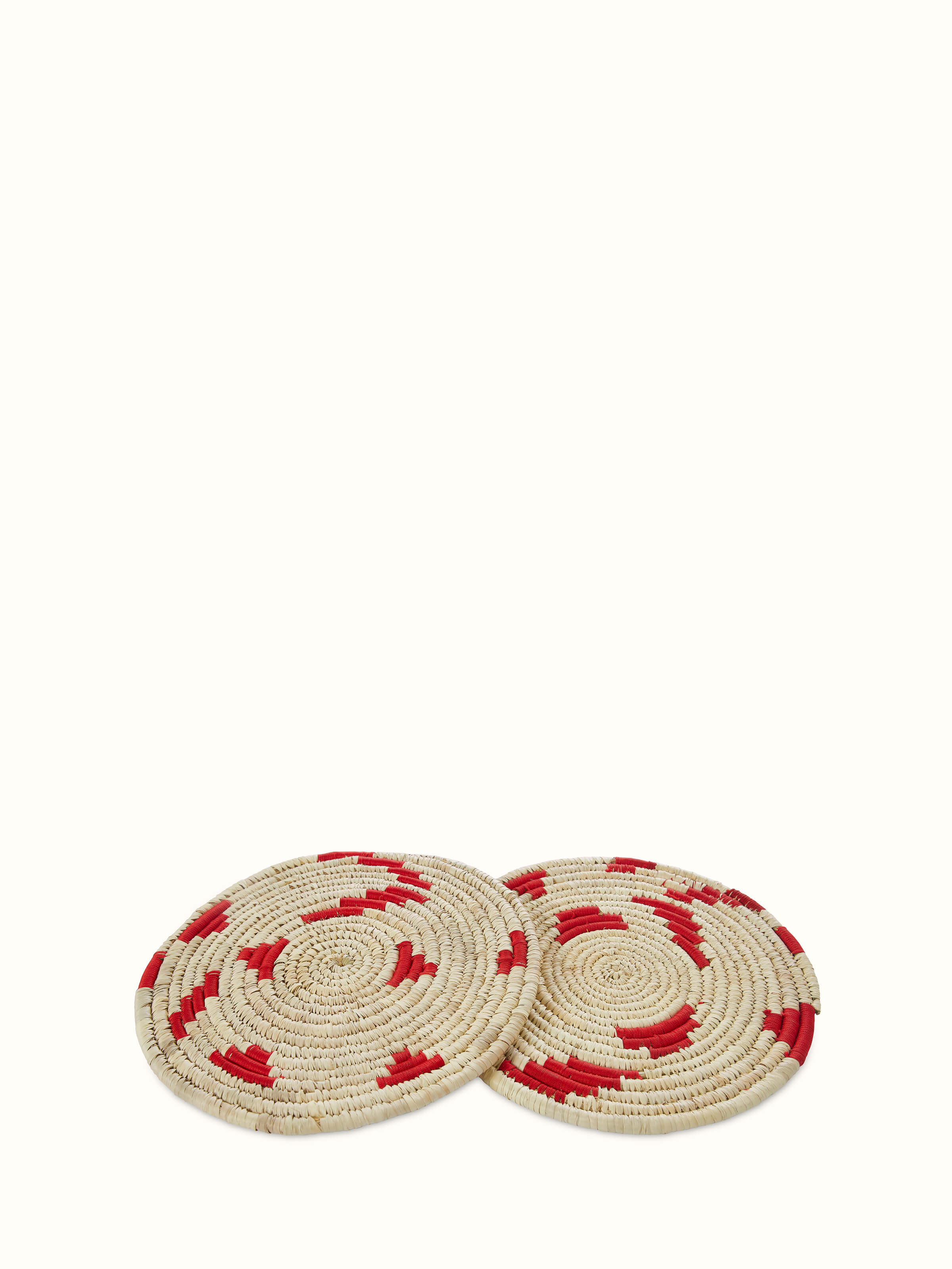 Front view of Kanshi Basketry Natural Fibre Trivets in red (2 pcs) highlighting the woven design and color.