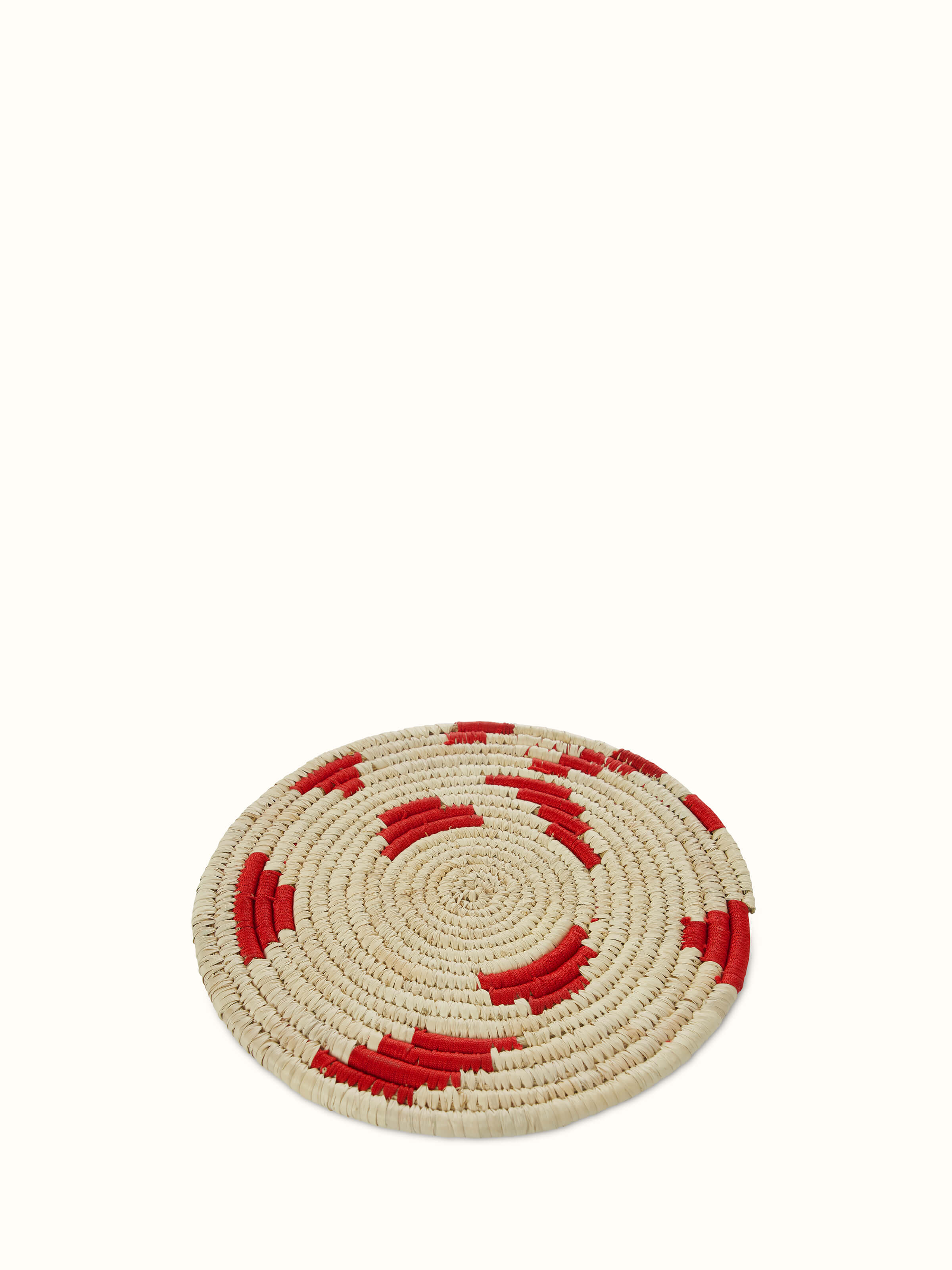 Detail view of Kanshi Basketry Natural Fibre Trivets in red (2 pcs) focusing on the intricate weaving and color.