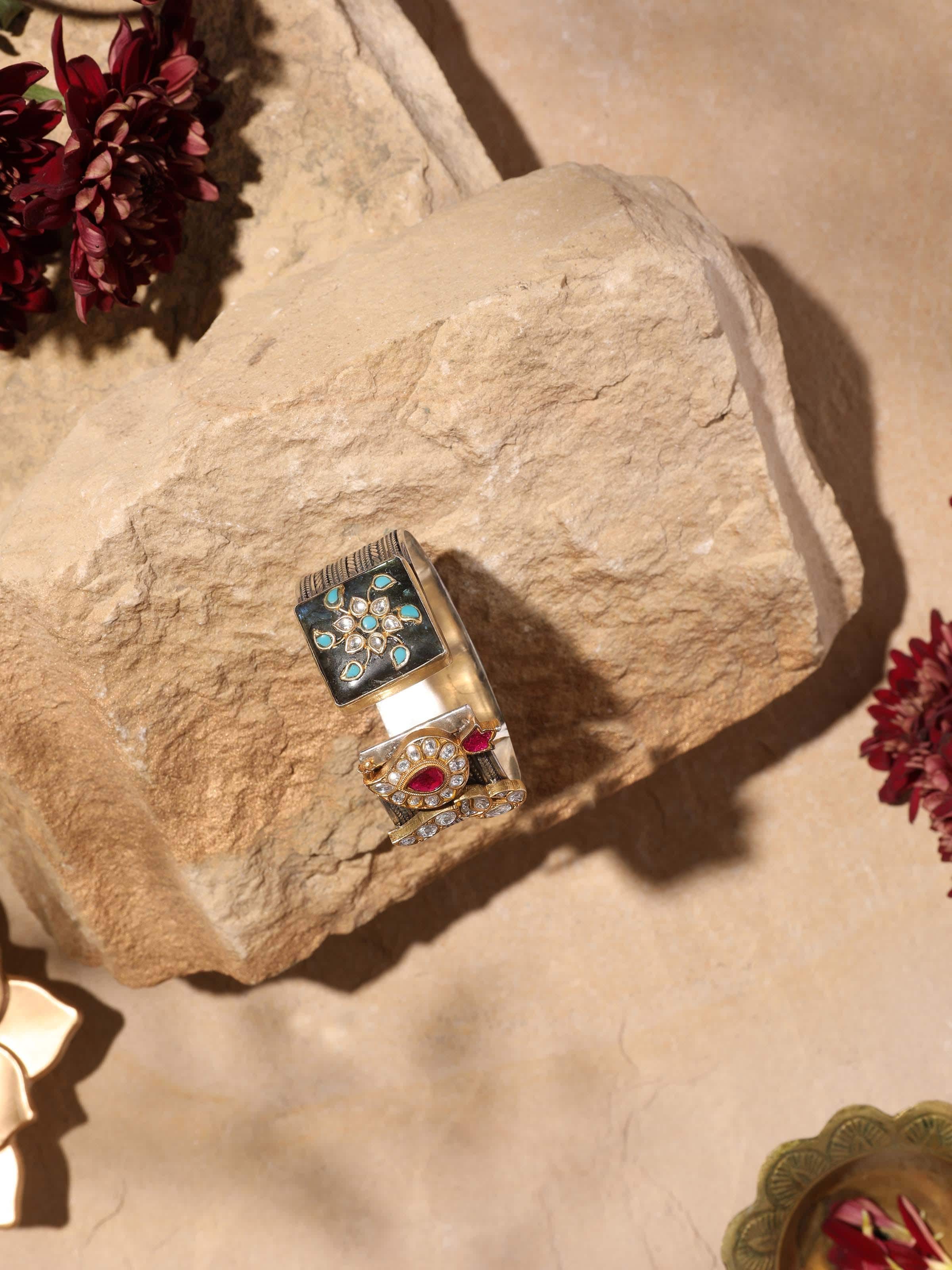 Detailed view of silver smithing bangle highlighting its intricate detailing and artistic finish.