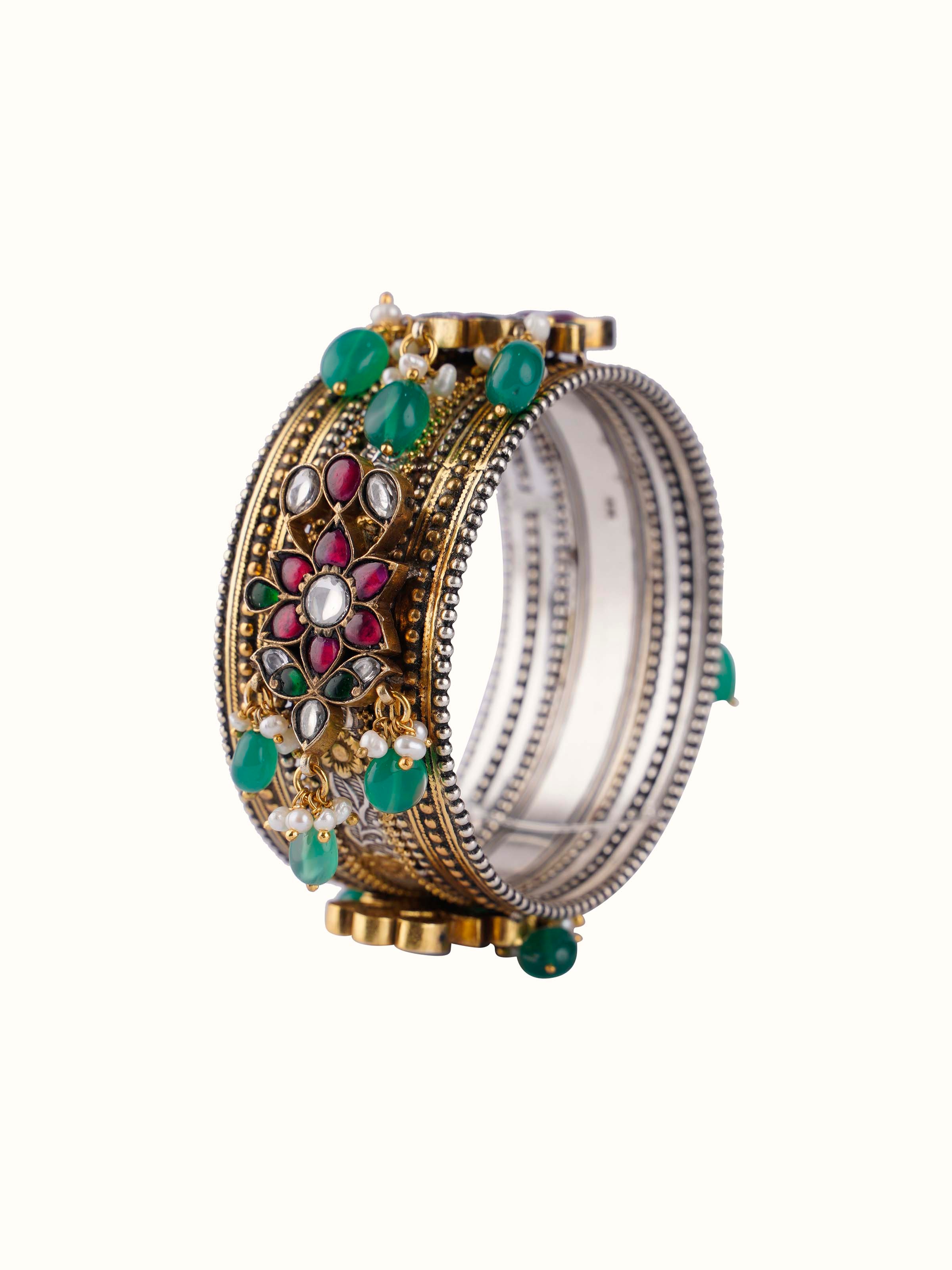 Front view of silver smithing bangle featuring a sleek and polished silver design.