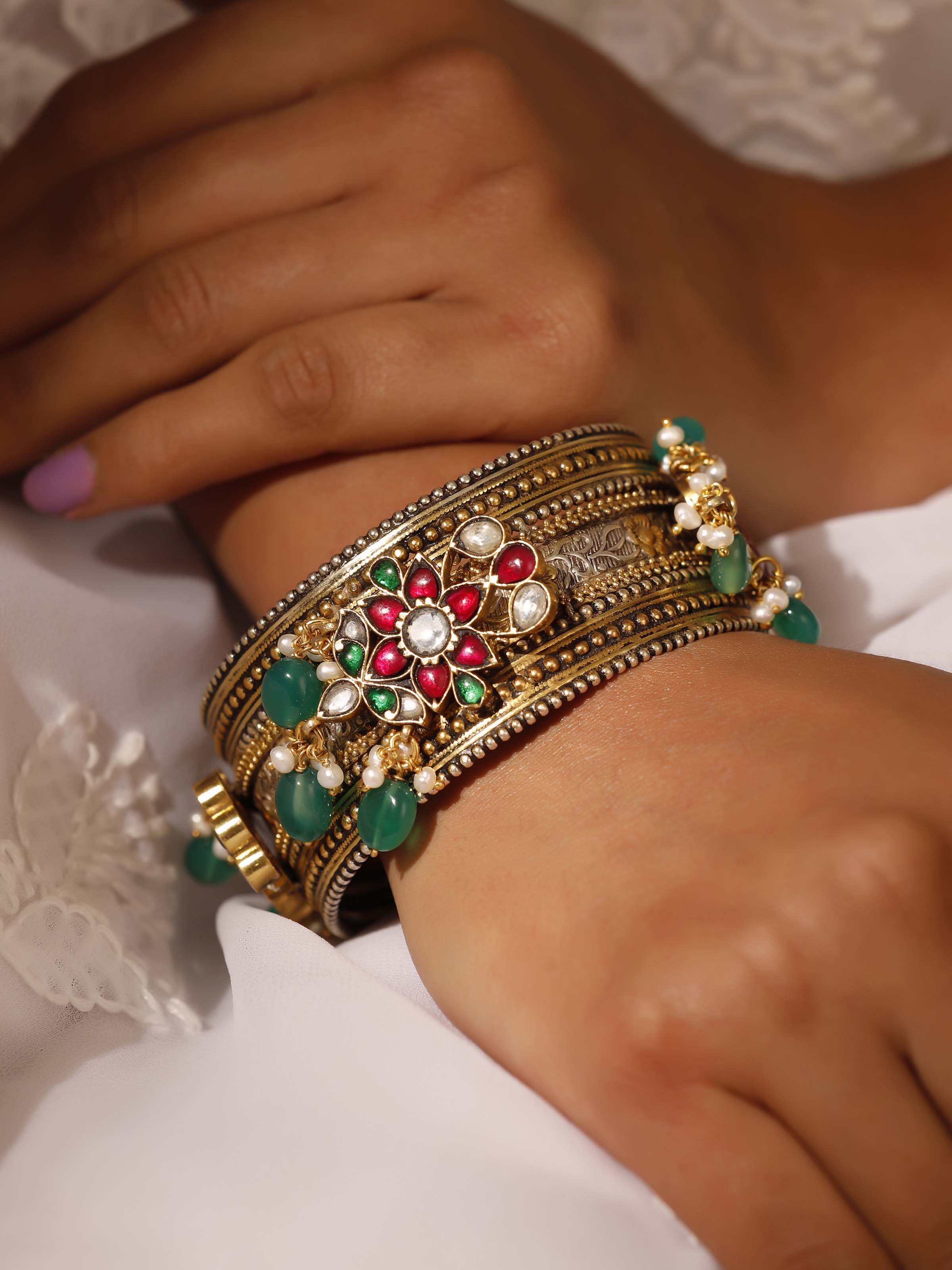 Side view of silver smithing bangle showcasing the elegant and refined silverwork.