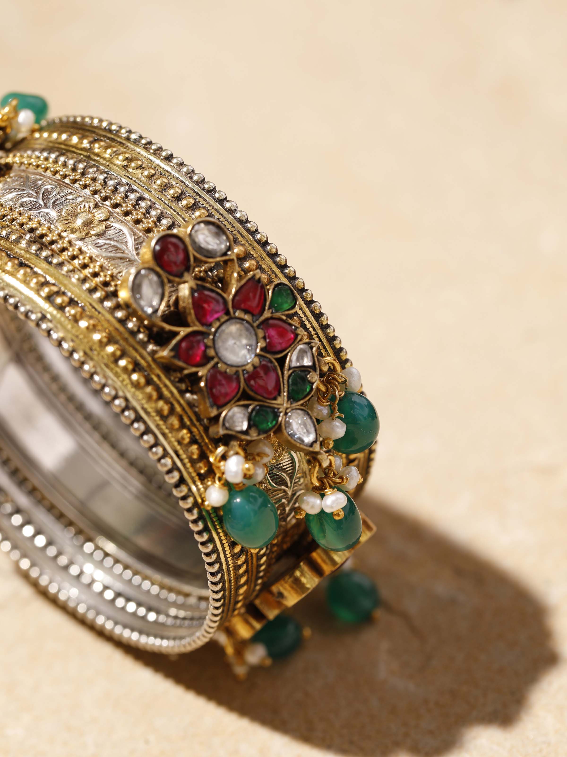 Back view of silver smithing bangle displaying the clasp and overall design.