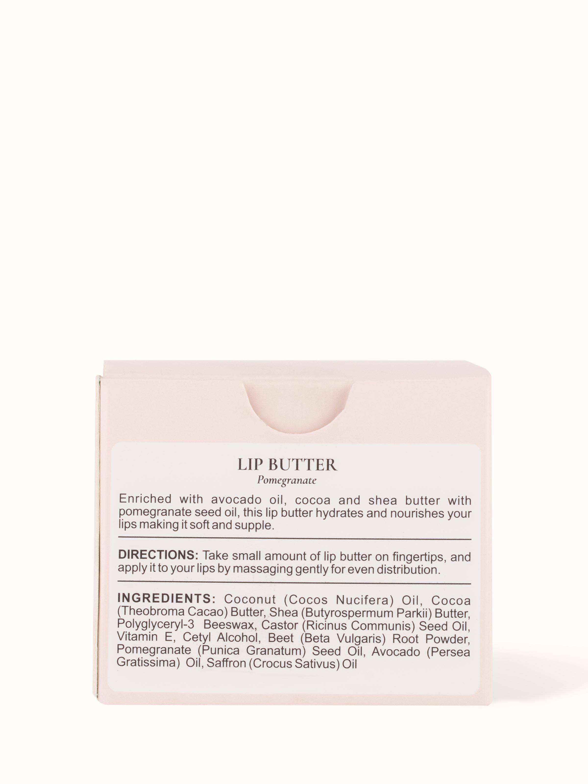 Back view of Lip Butter Pomegranate jar displaying the product’s ingredients and usage information on the label.