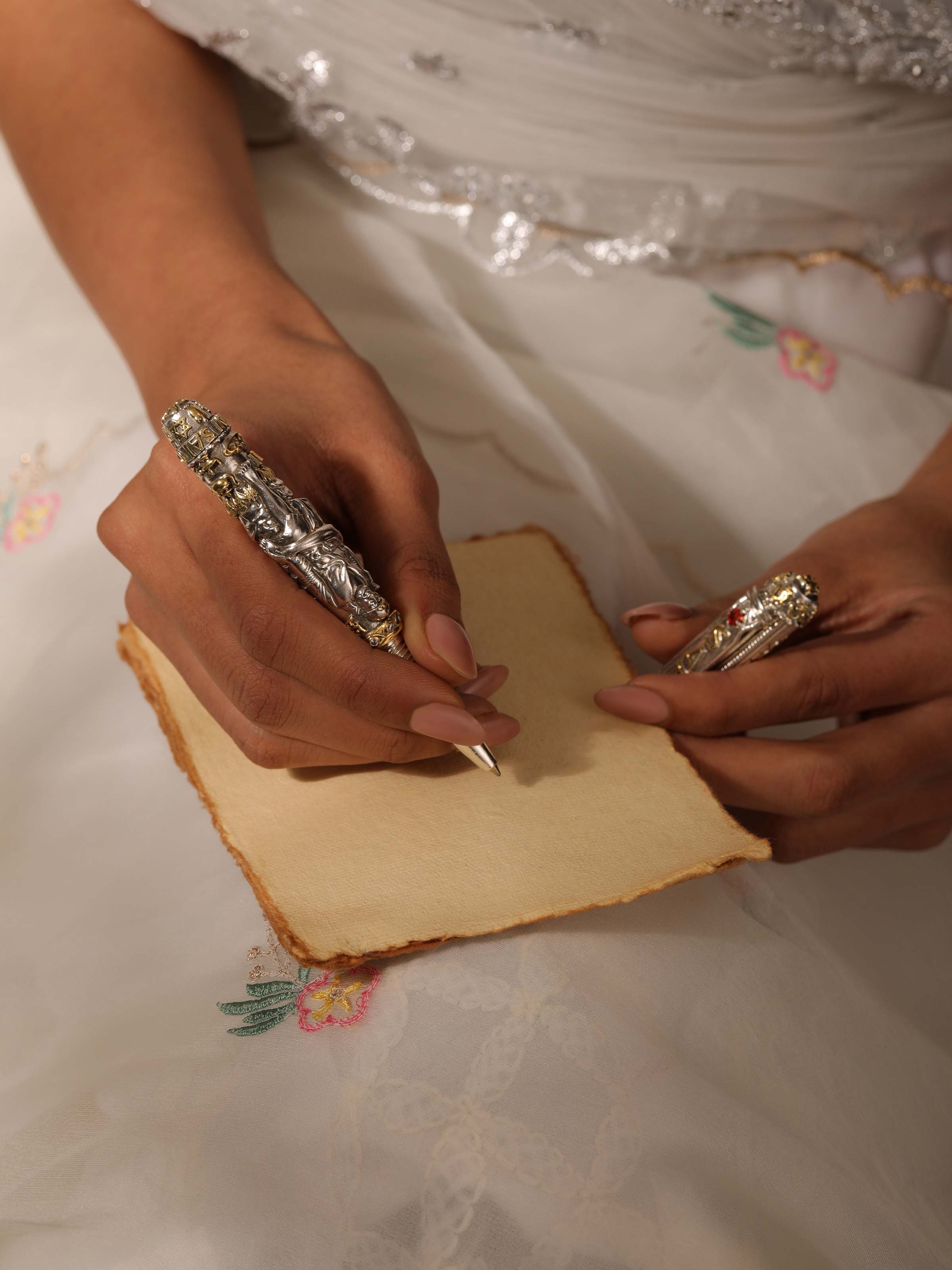 Close-up of Lord Sai Baba Silver Smithing Pen highlighting the detailed silverwork and craftsmanship.