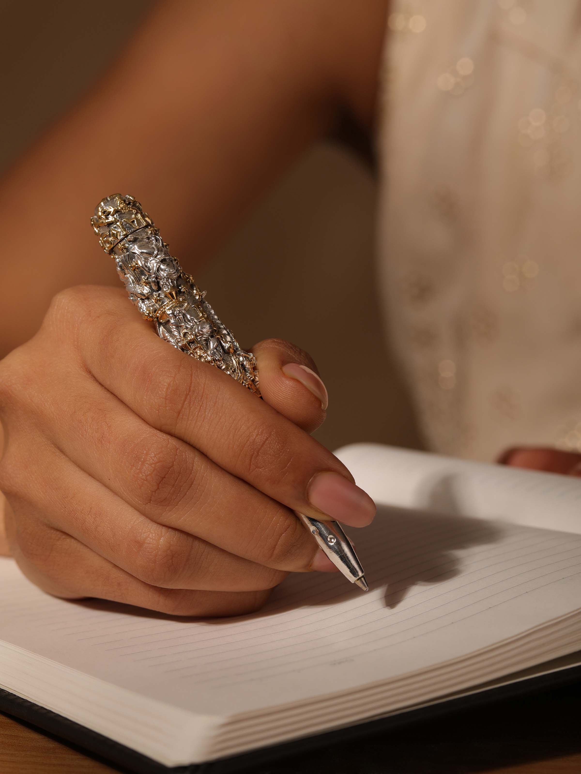 Side view of Figures Silver Smithing Pen showcasing detailed metalwork and elegant design.