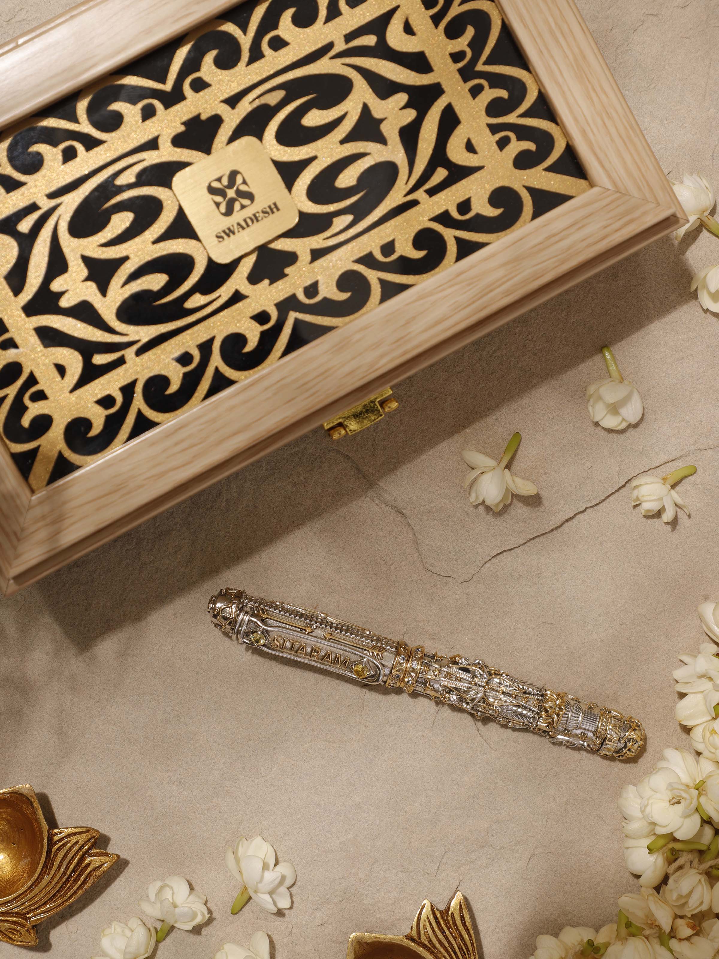 Overhead view of Figures Silver Smithing Pen displaying detailed metalwork and elegant design.