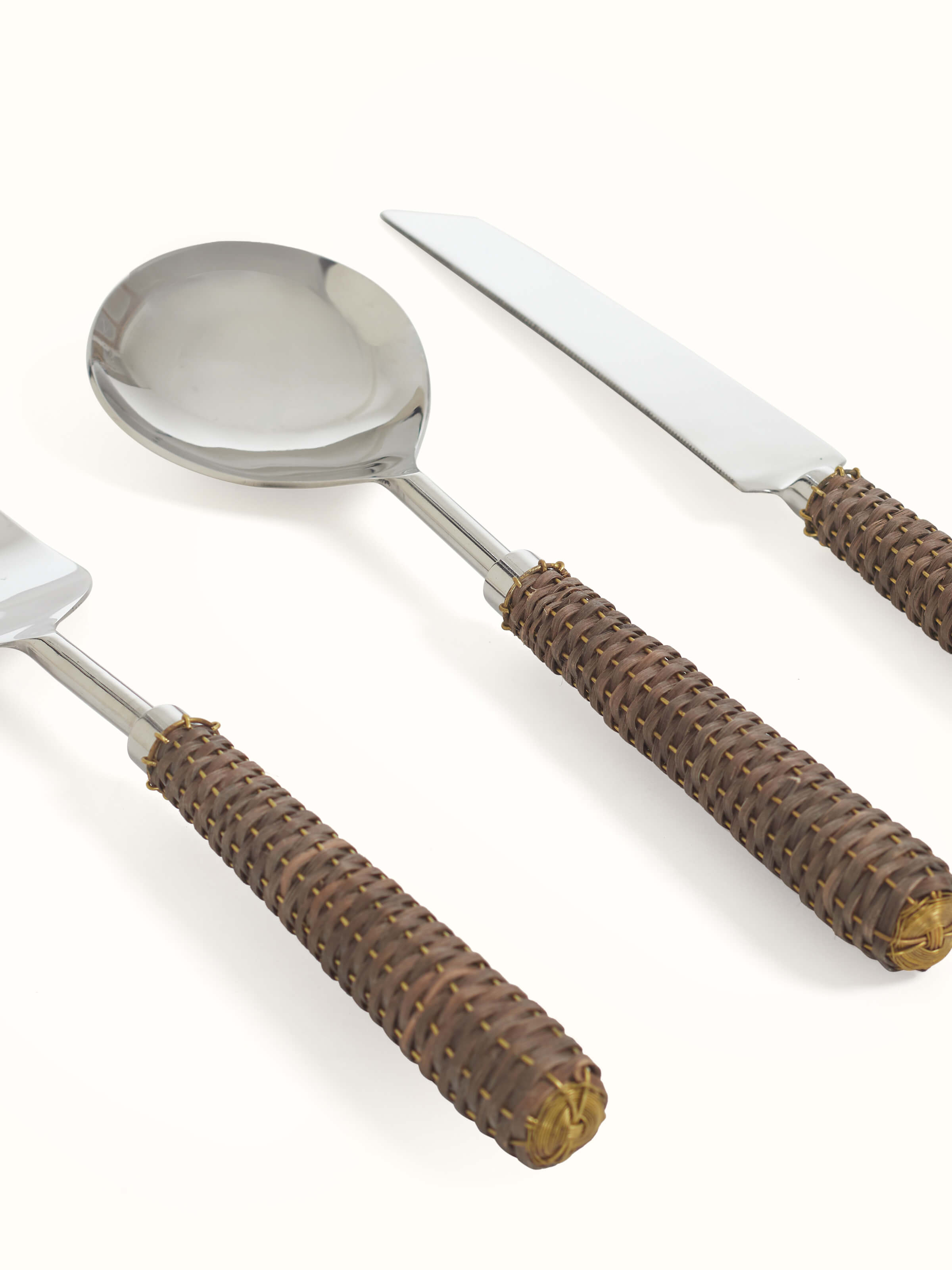 Artistic view of Rattan handle stainless steel cutlery set (3 pcs), focusing on design and functionality.