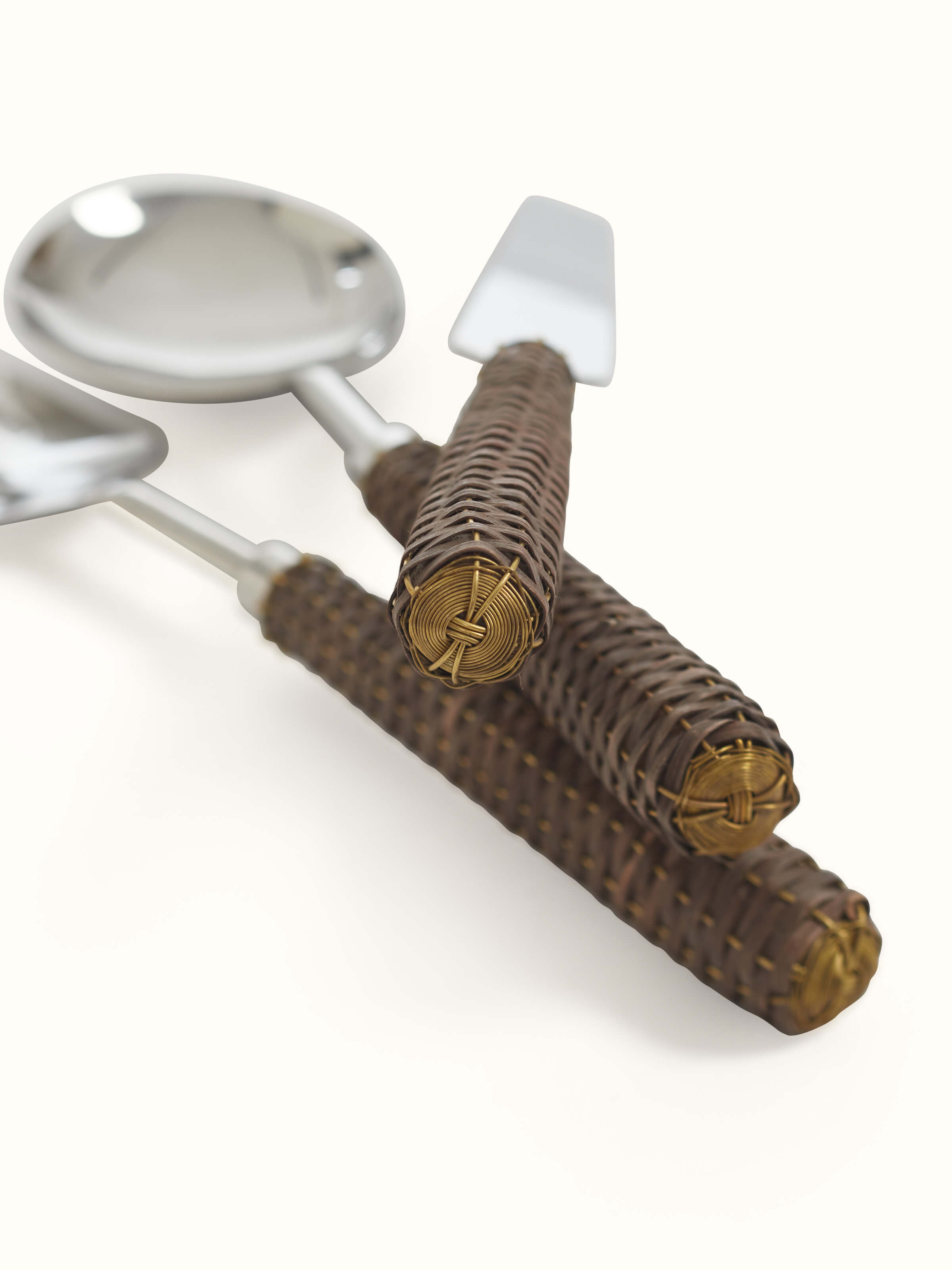 Close-up view of Rattan handle stainless steel cutlery set (3 pcs), showcasing handle details and finish.