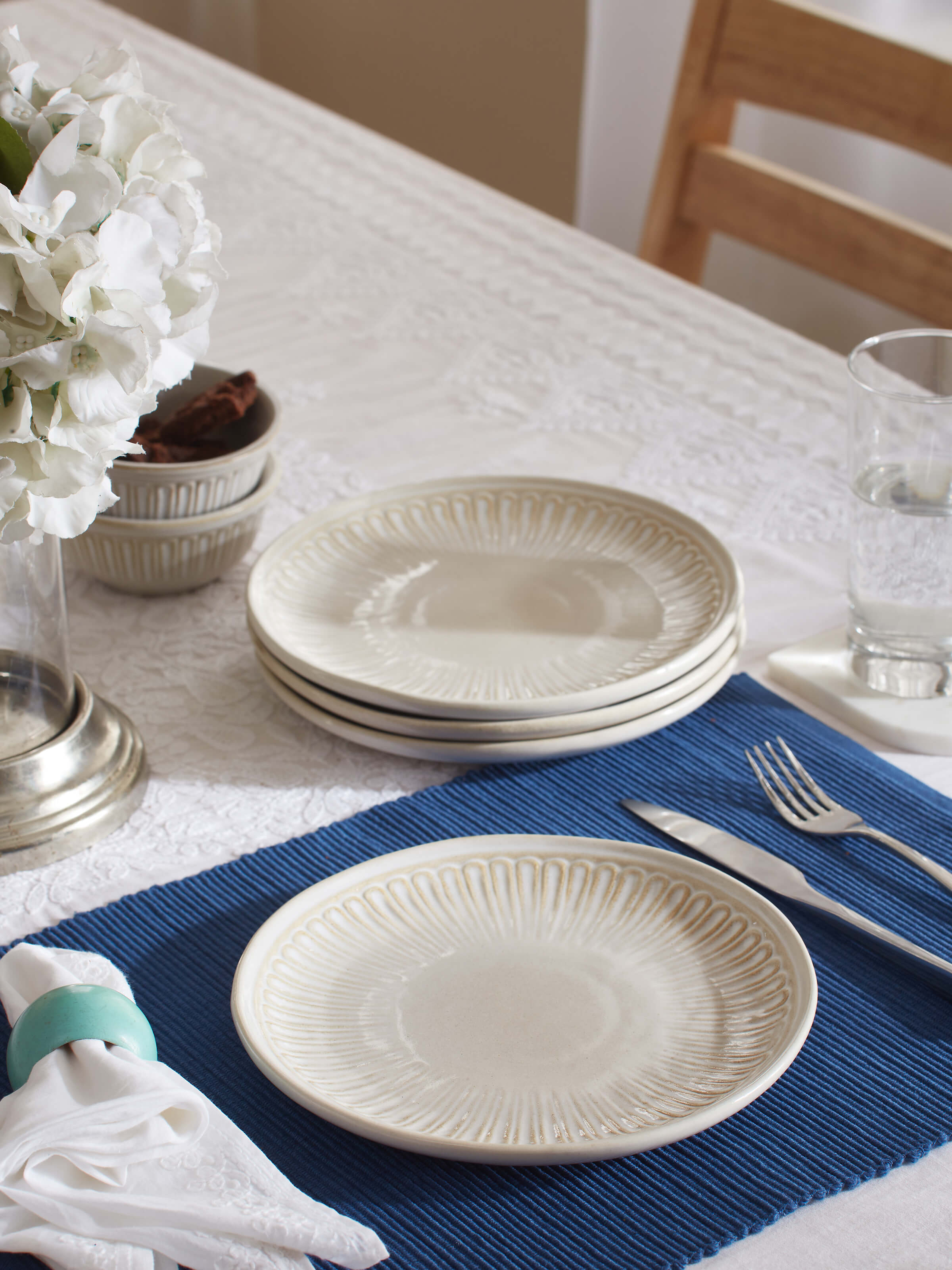 Angled view of Studio Pottery Ceramic Dinner Plates in White, highlighting the smooth glaze and shape