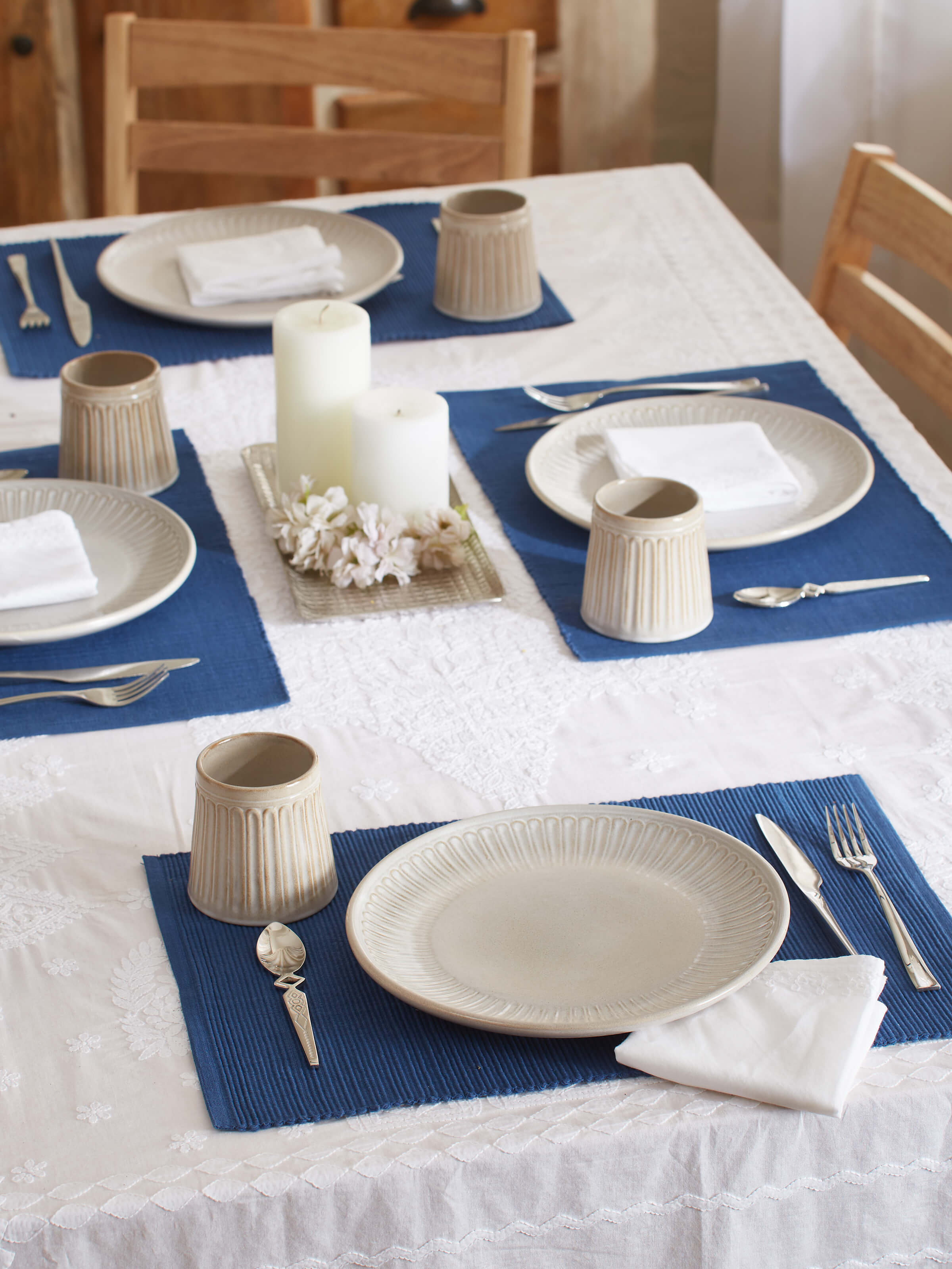 Angled view of Studio pottery ceramic side plates (4 pcs) focusing on their smooth white glaze and modern aesthetic