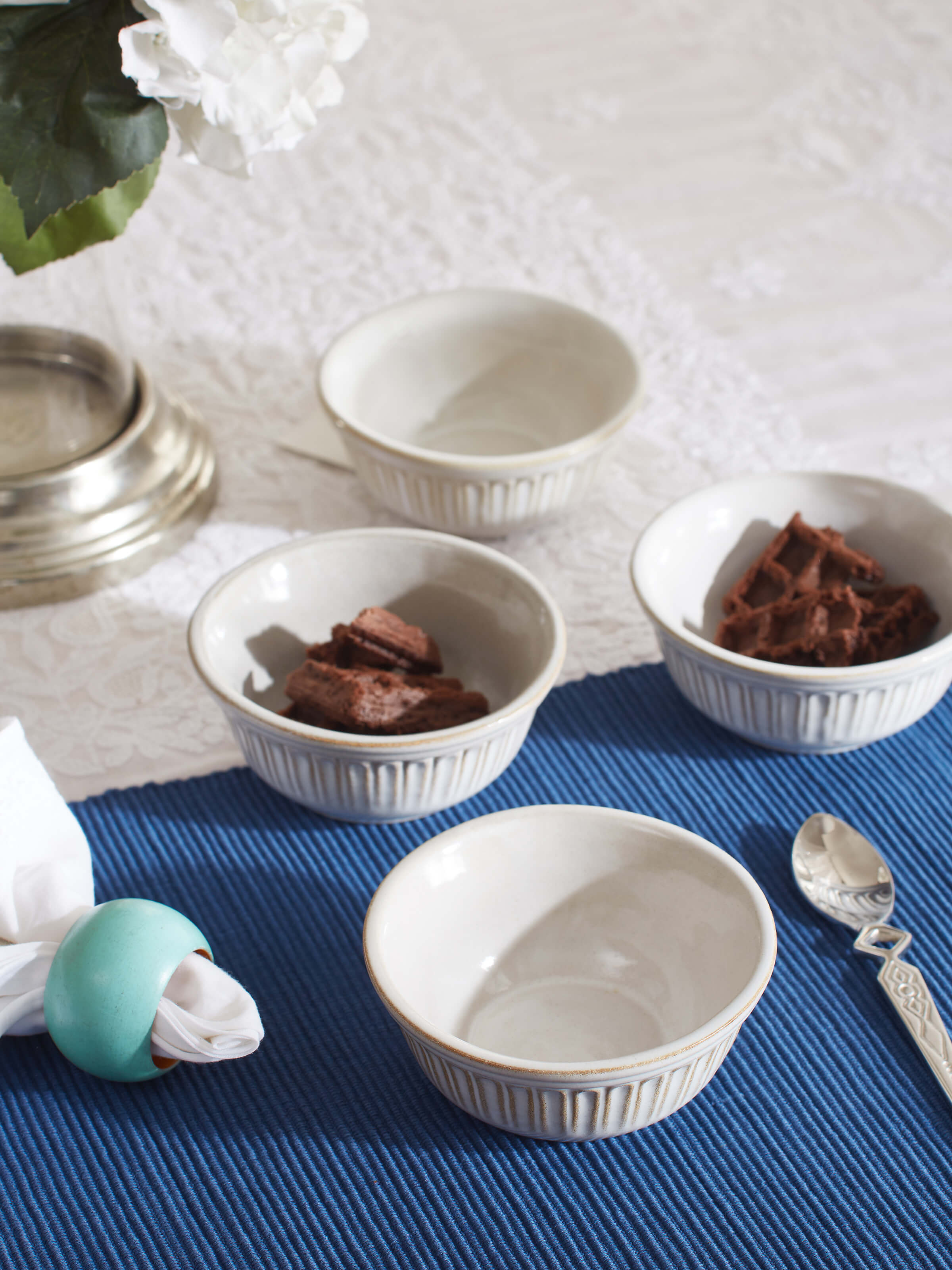 Side view of Glass-finished studio pottery ceramic dinner bowls in white (4 pcs) highlighting the sleek curves and contemporary style