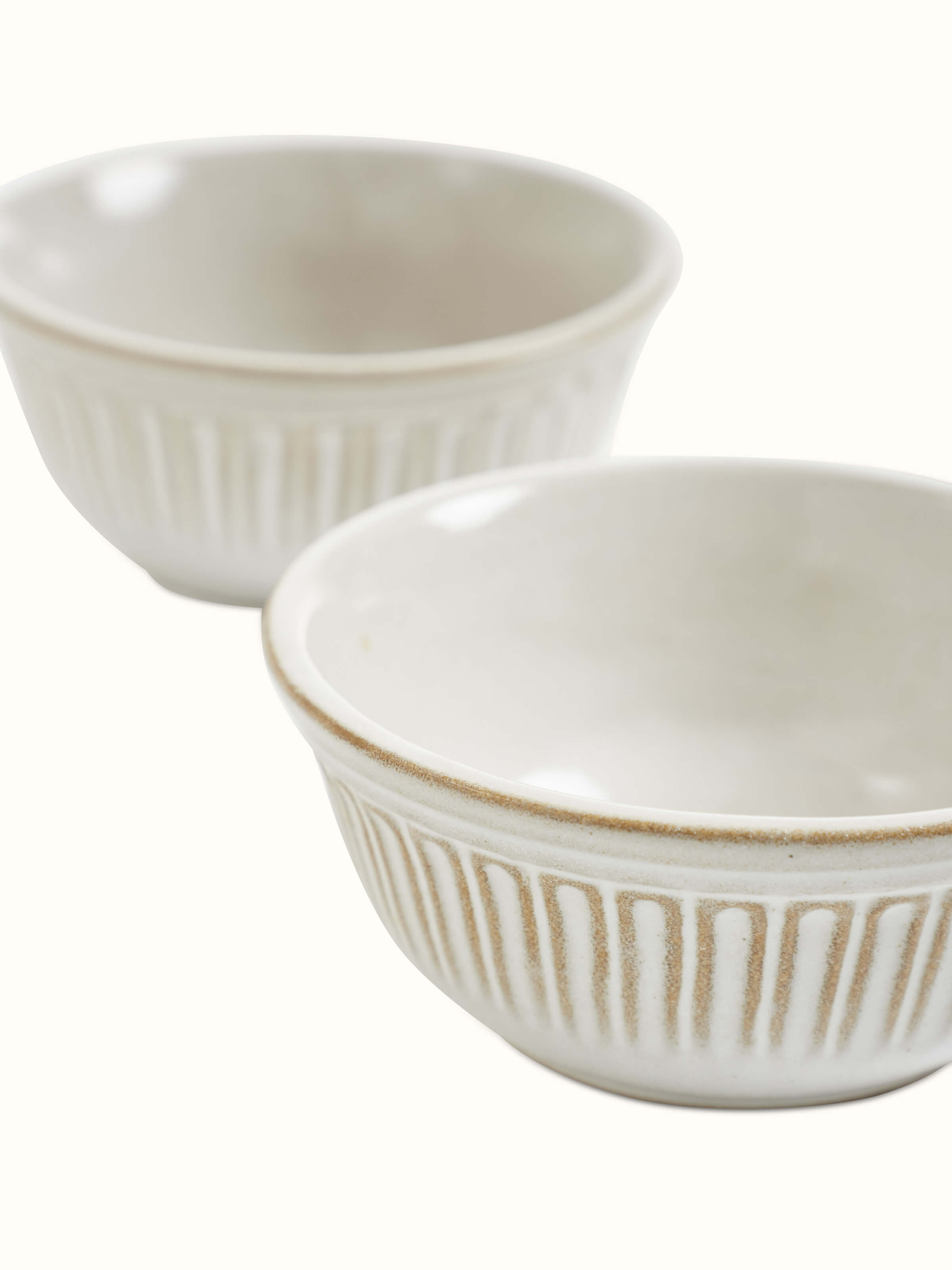 Complete set of Glass-finished studio pottery ceramic dinner bowls in white (4 pcs) arranged to highlight their elegant and uniform design