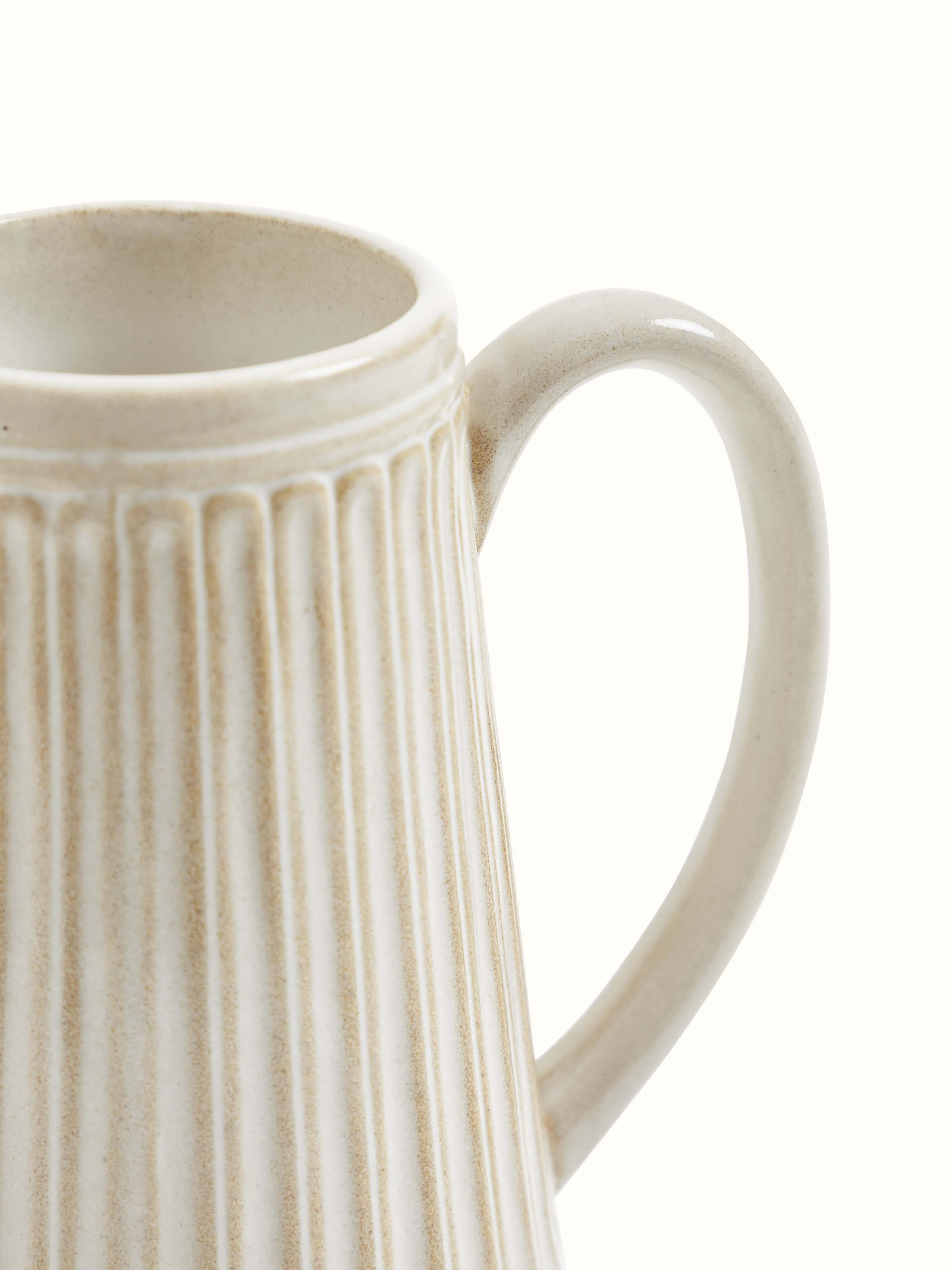Studio Pottery Ceramic Jug with detailed texture on surface.