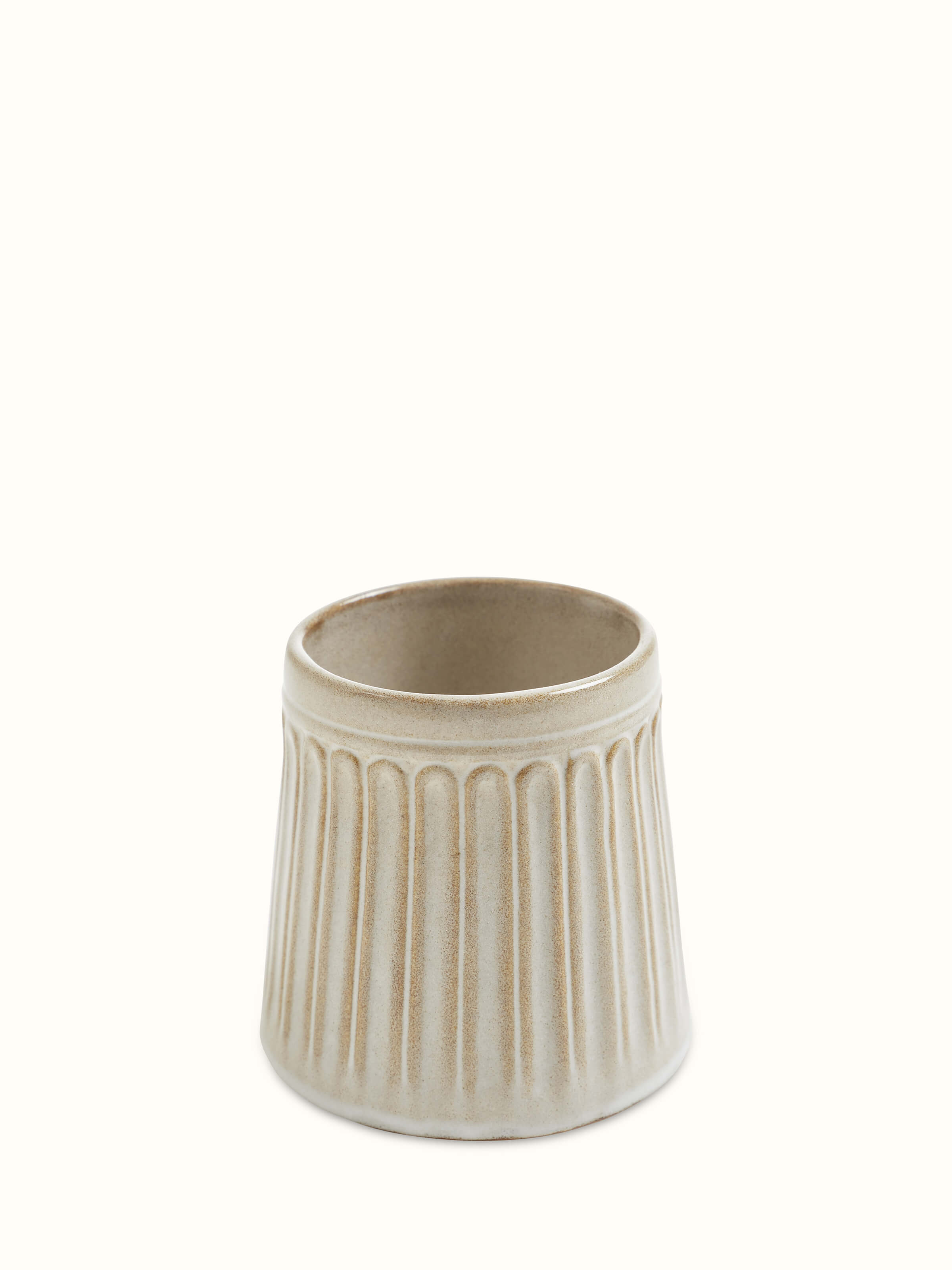 Set of beige studio pottery ceramic water tumblers, showcasing their elegant and functional design.