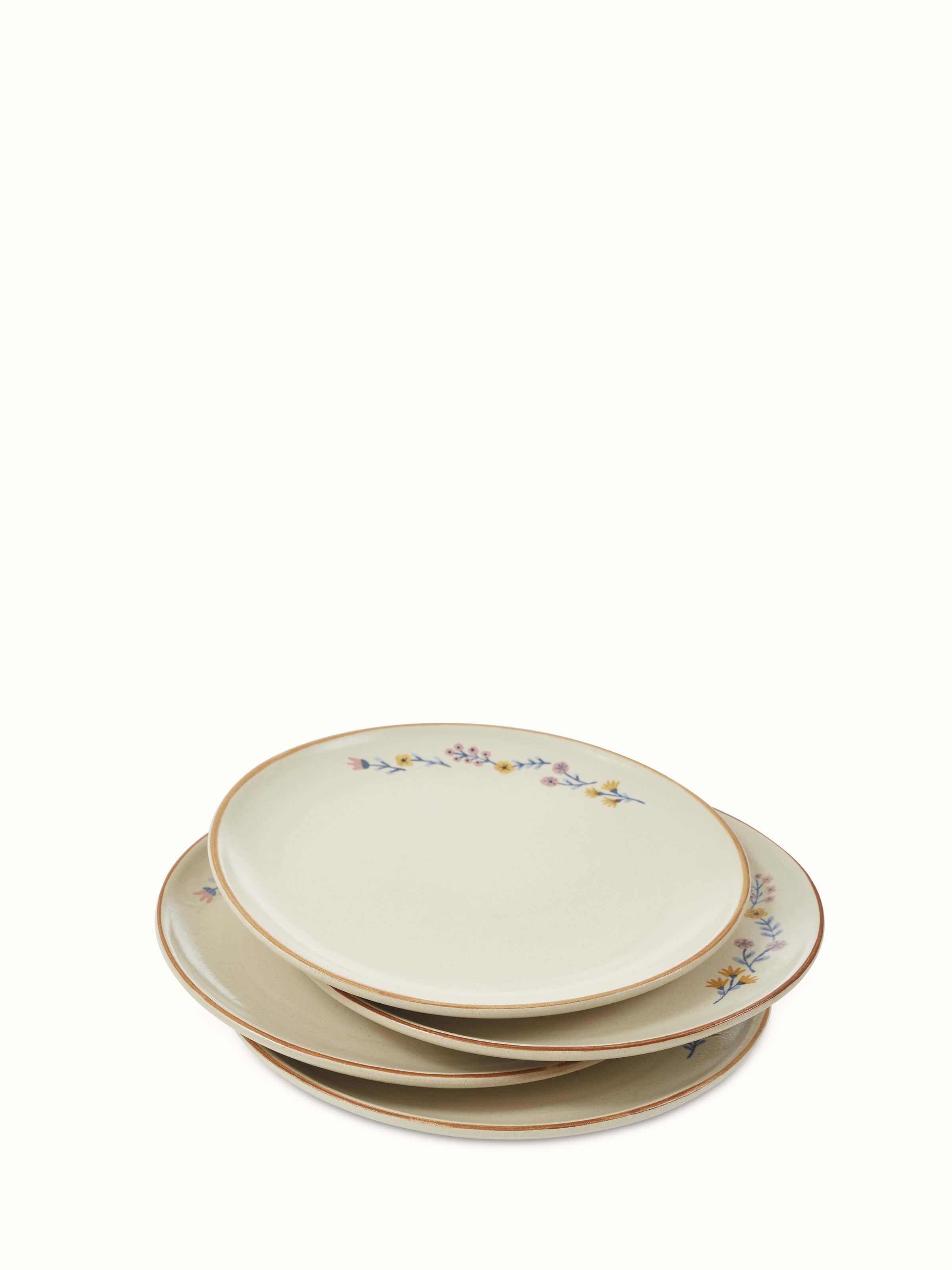 Front view of beige studio pottery ceramic dinner plates set of 4, highlighting the elegant design