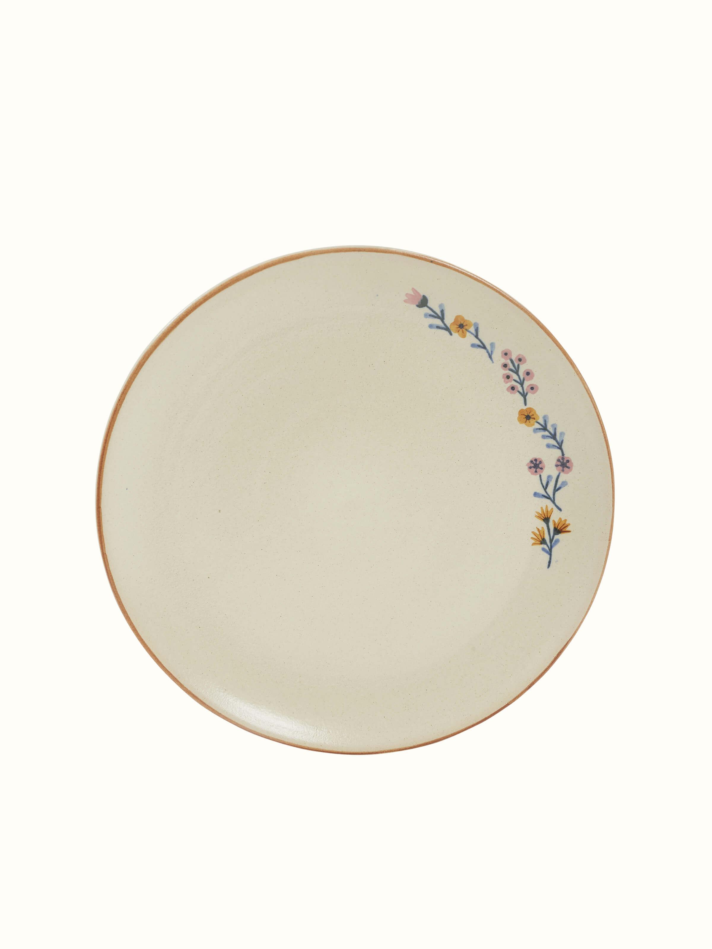 Angled view of beige studio pottery ceramic dinner plates set of 4, highlighting the elegant design details
