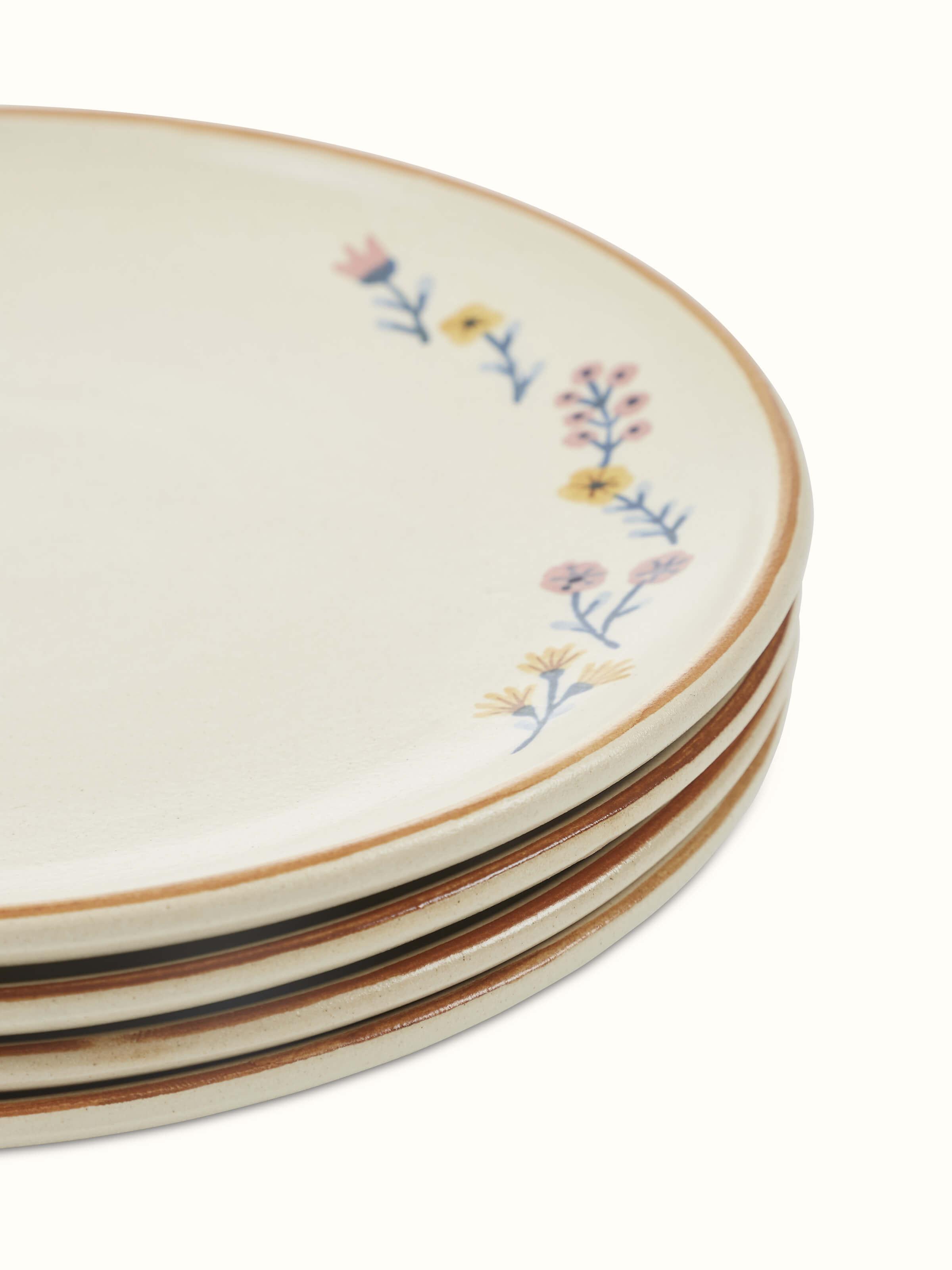 Detailed view of beige studio pottery ceramic dinner plates set of 4, showcasing the craftsmanship