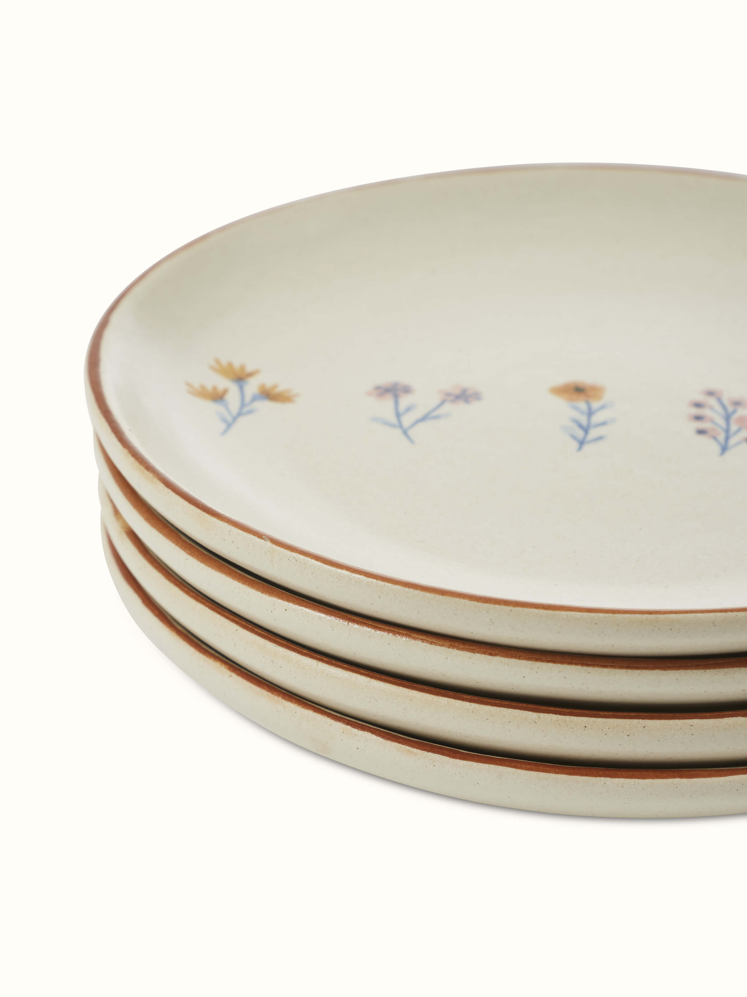 Side view of Studio pottery ceramic side plates in beige (4 pcs) highlighting details