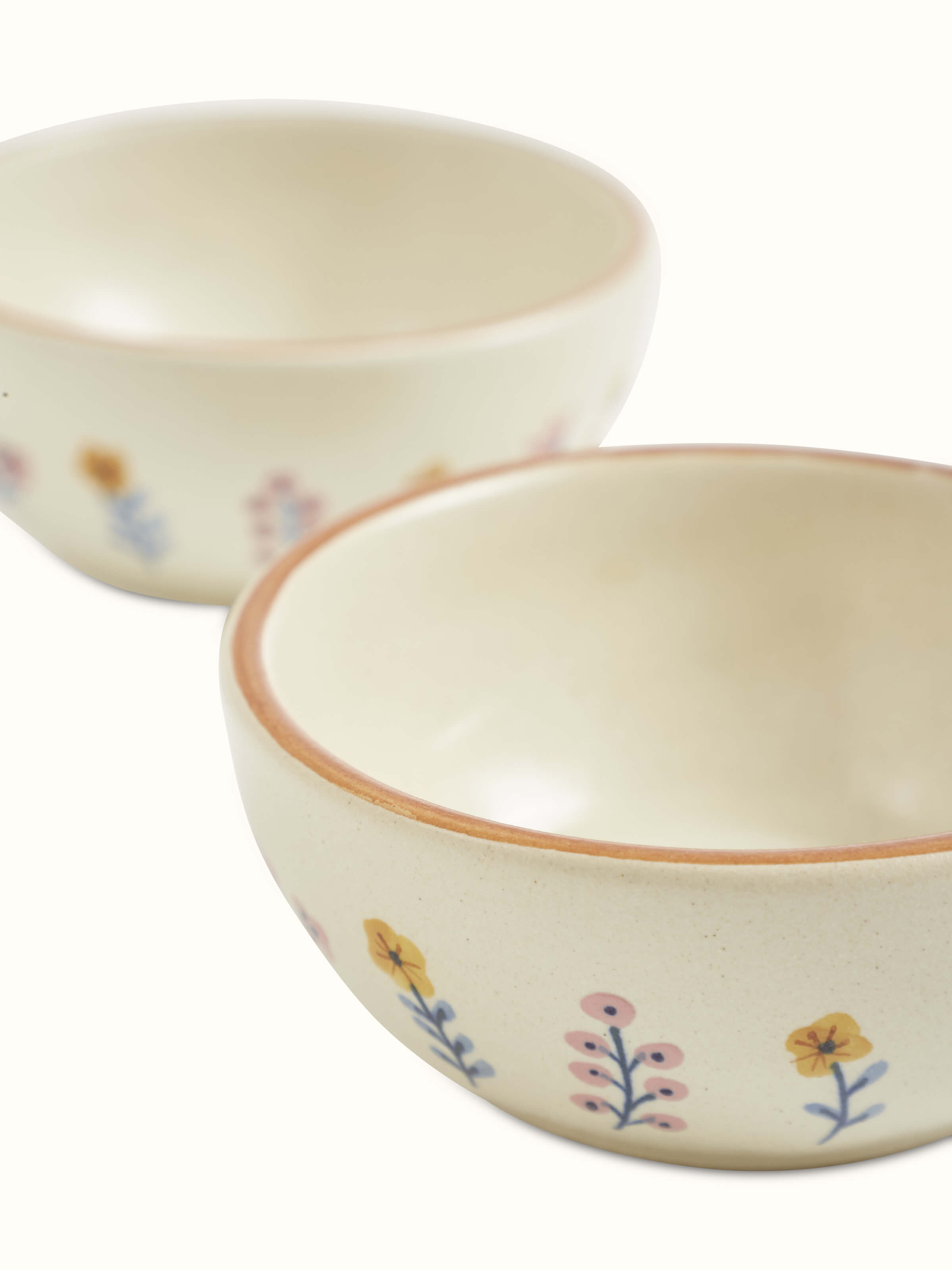 Overhead view of Studio Pottery Ceramic Dinner Bowls in Beige, showing the clean lines and uniform color