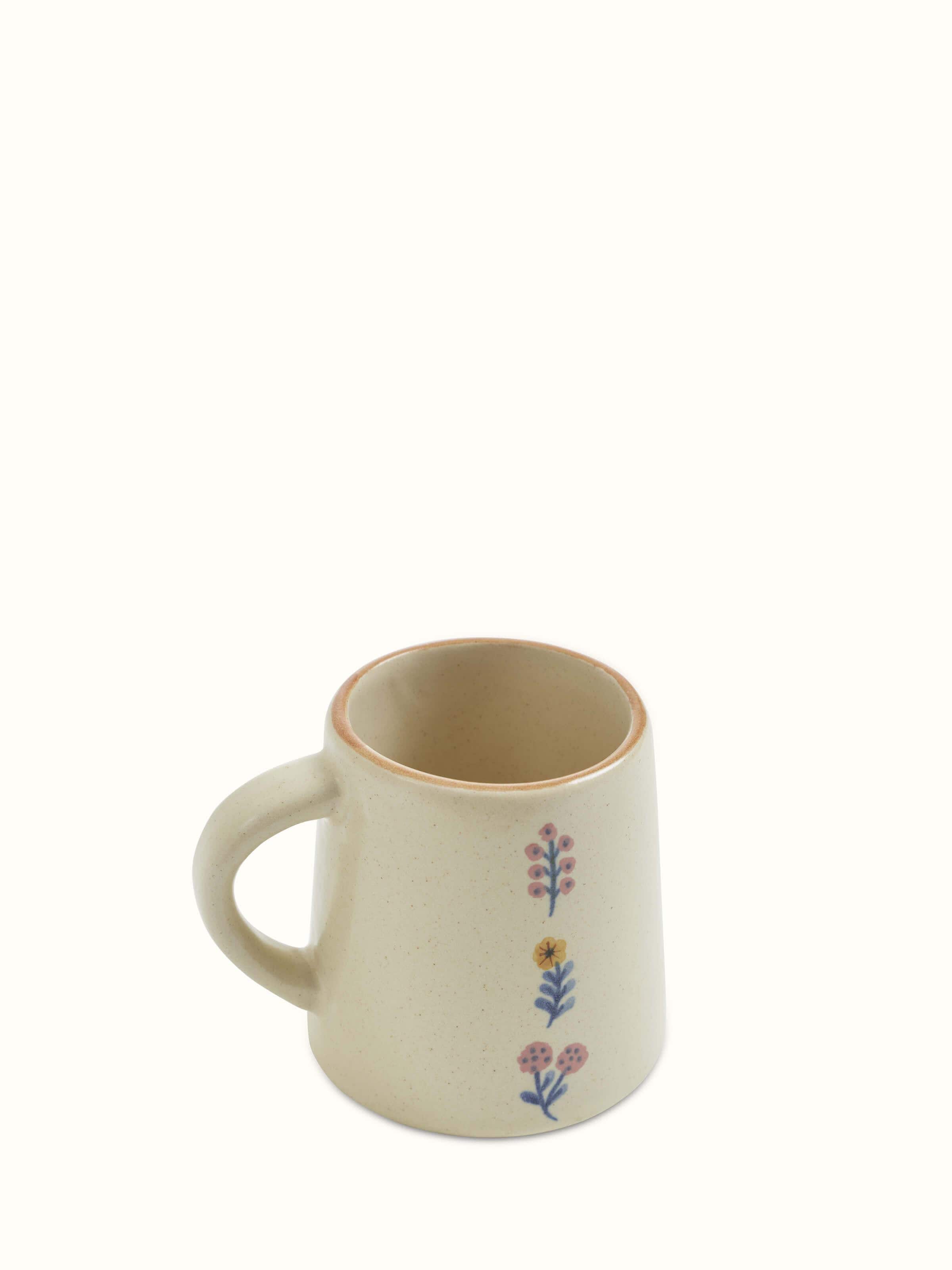 Angled view of Studio Pottery Ceramic Coffee Mugs set of 4, showcasing the handmade quality and distinct pottery style.