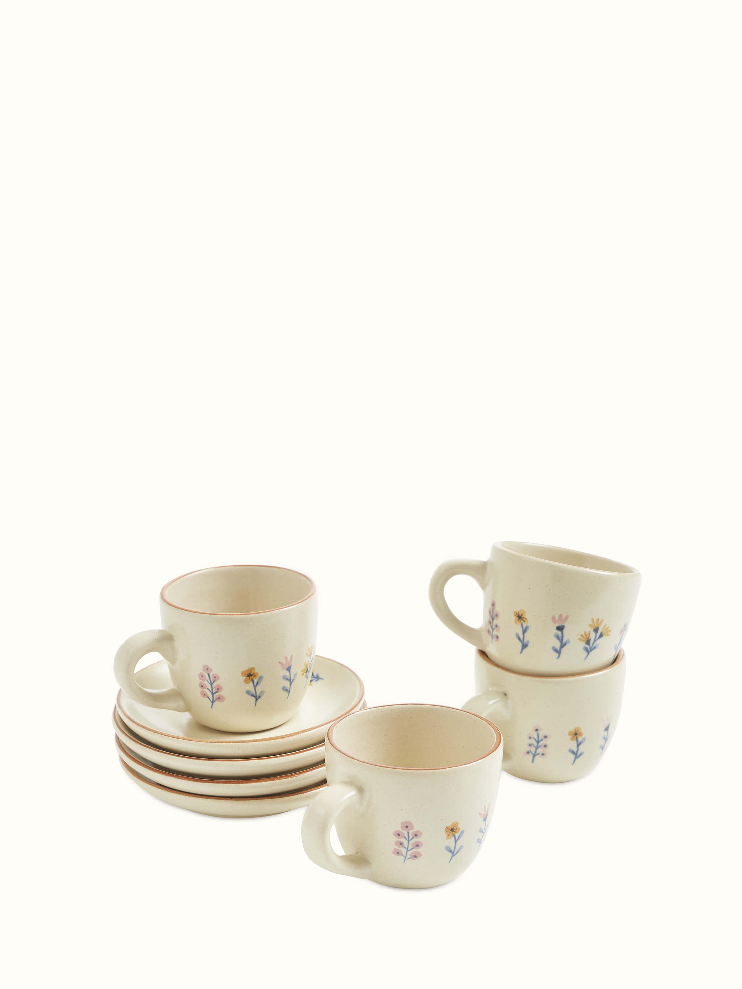 Front view of studio pottery ceramic teacups set highlighting the set of four
