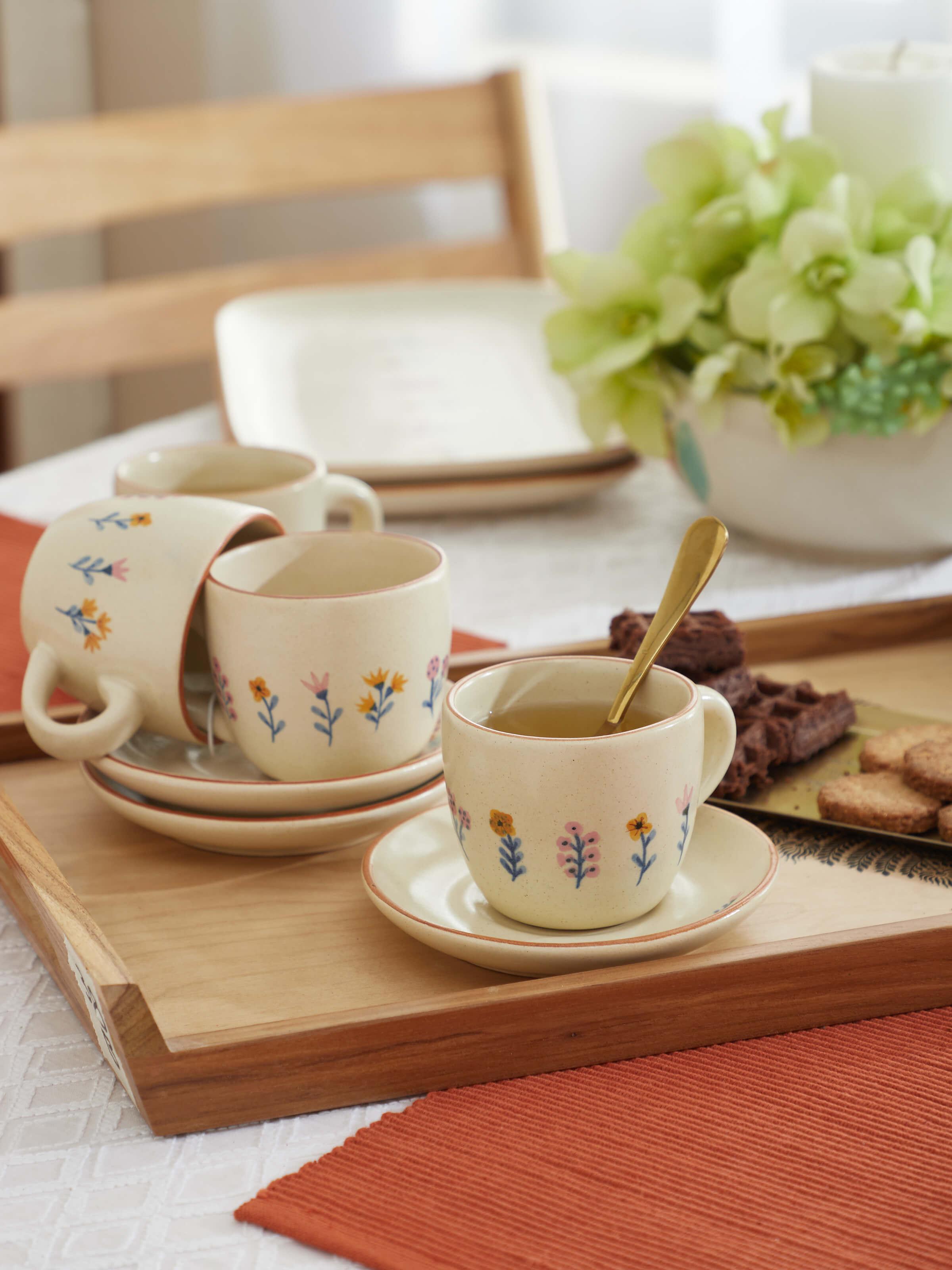Side view of studio pottery ceramic teacups set showing the design details