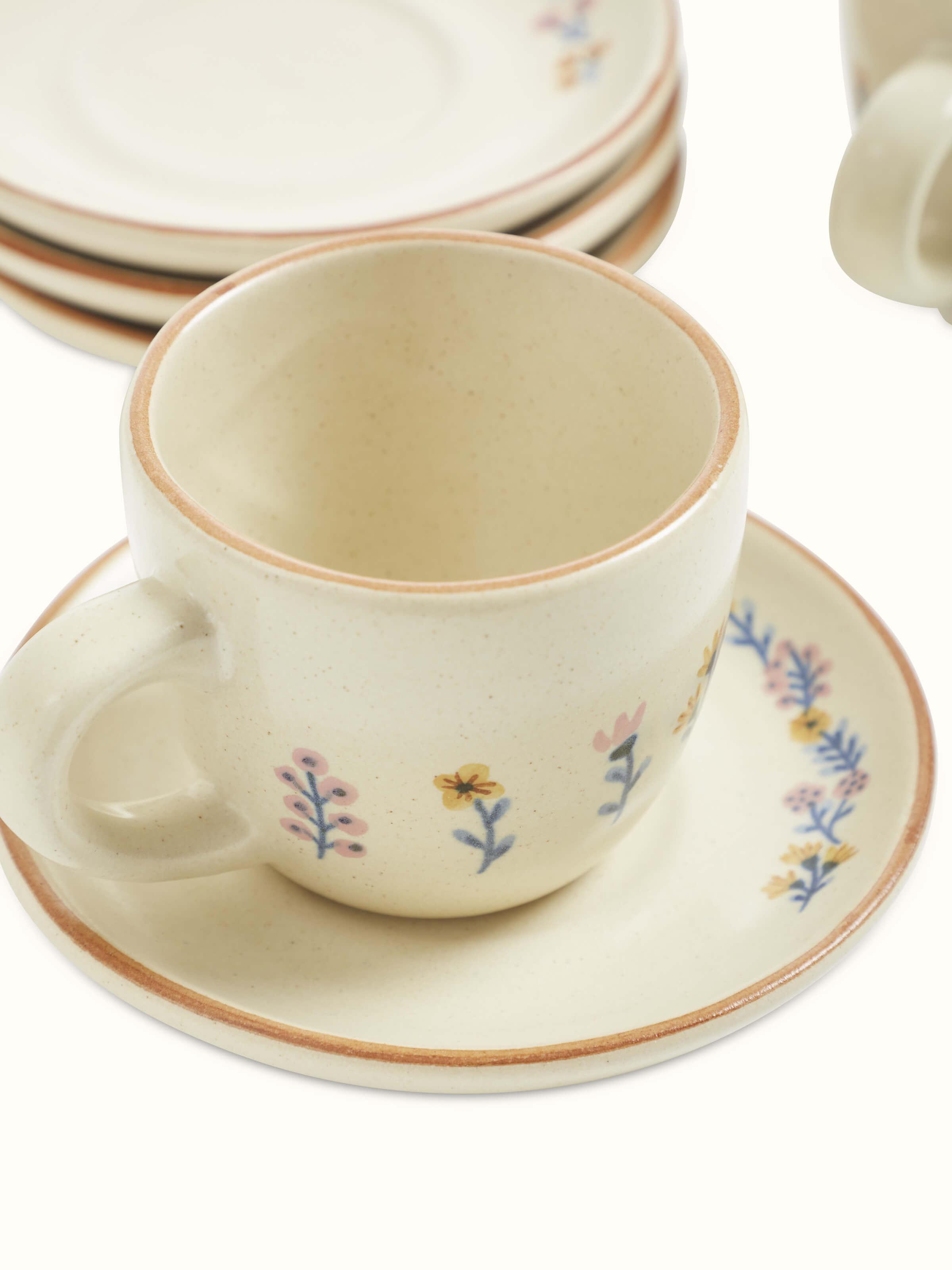 Detailed view of studio pottery ceramic teacups showing intricate design elements