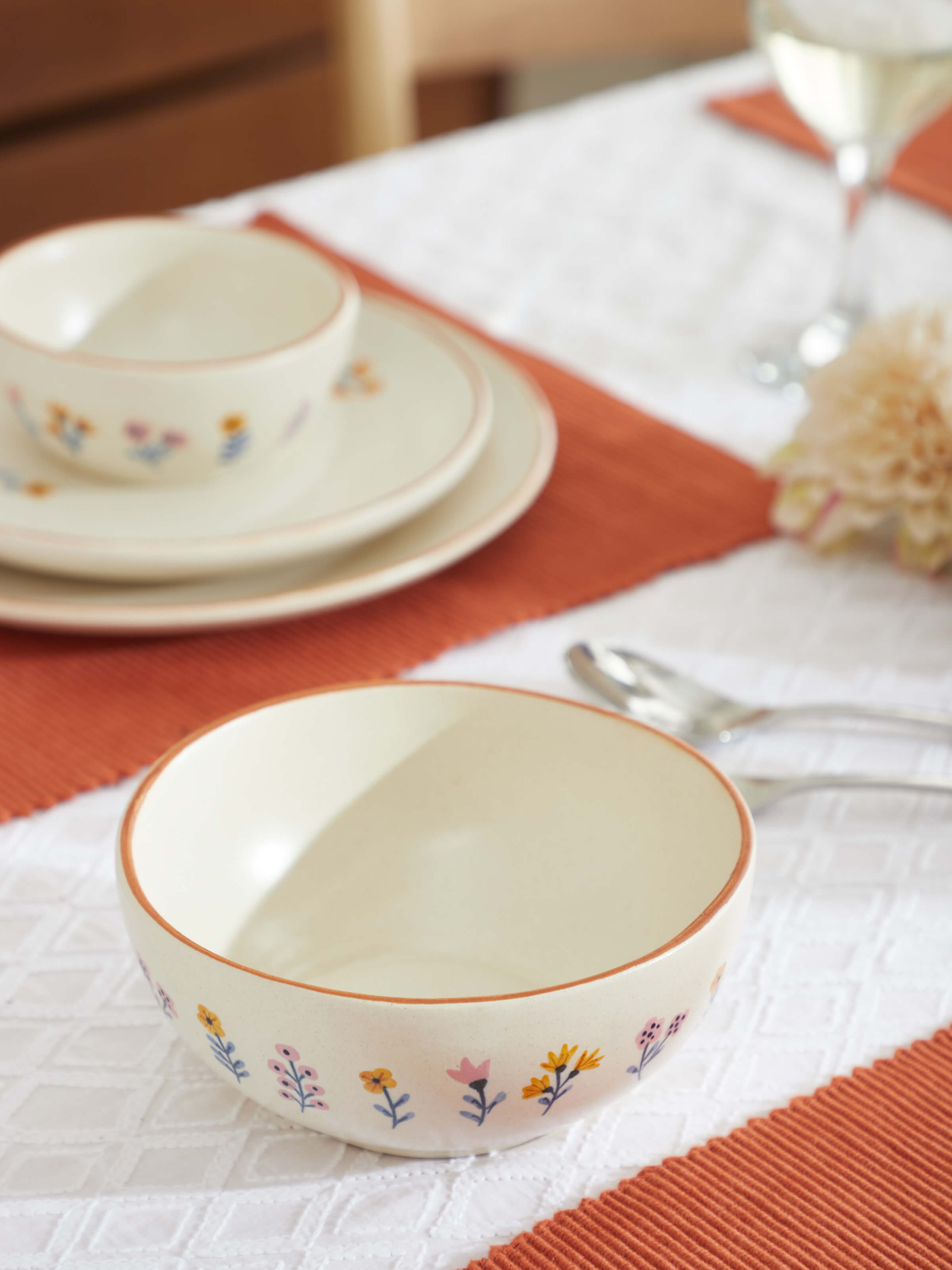 Side view of satin finish studio pottery ceramic serving bowl, highlighting the sleek design and glossy texture.