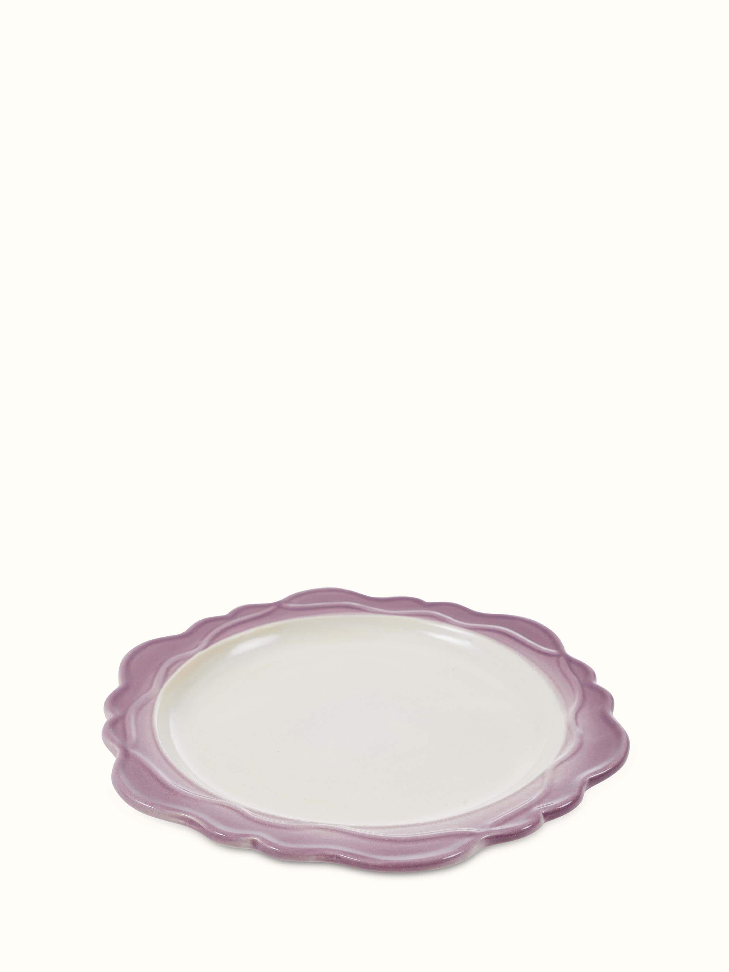 Top view of studio pottery ceramic dinner plates in pink (4 pcs) showing their round shape and design.