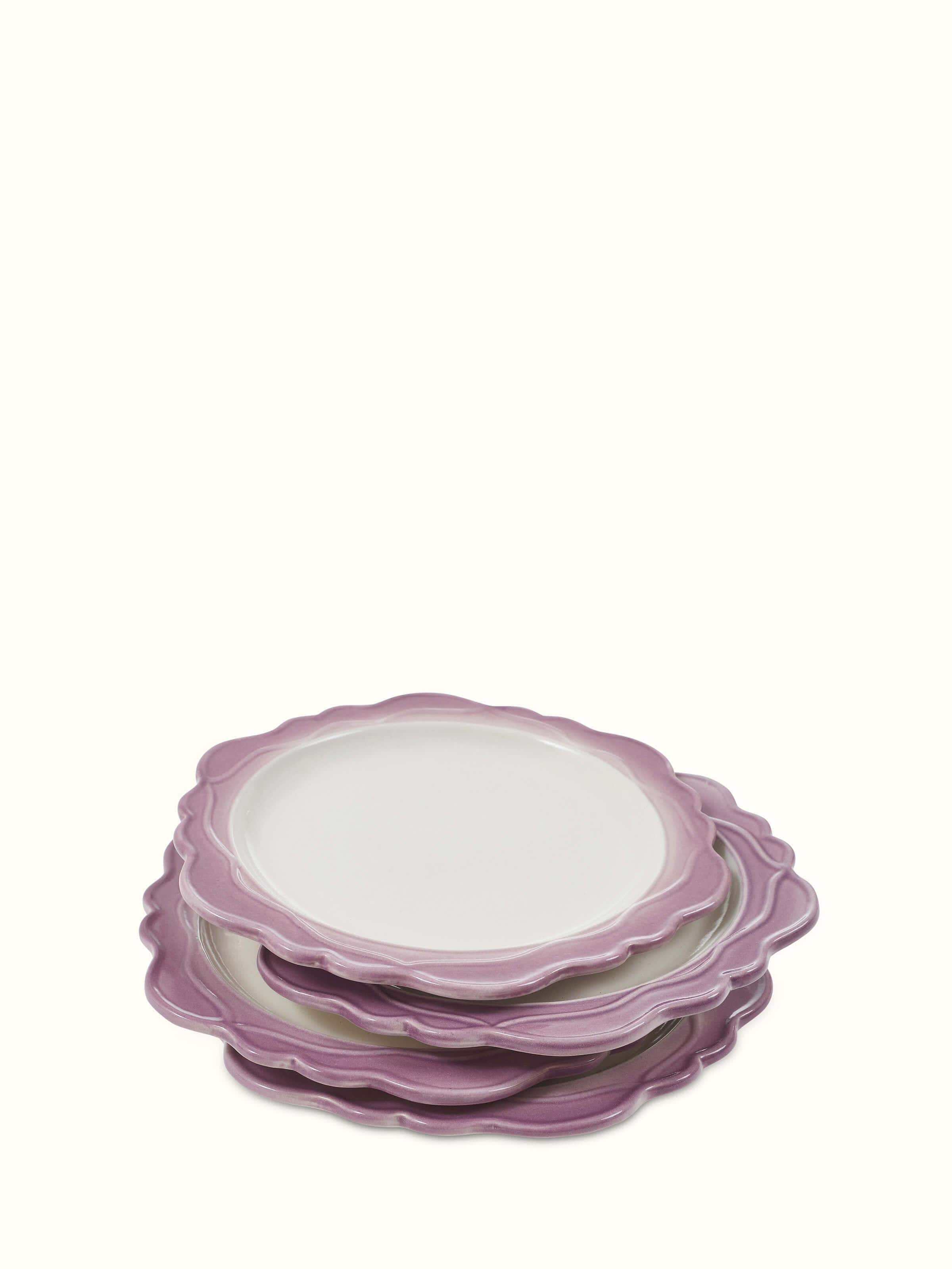 Front view of studio pottery ceramic dinner plates in pink (4 pcs) displaying their smooth finish.