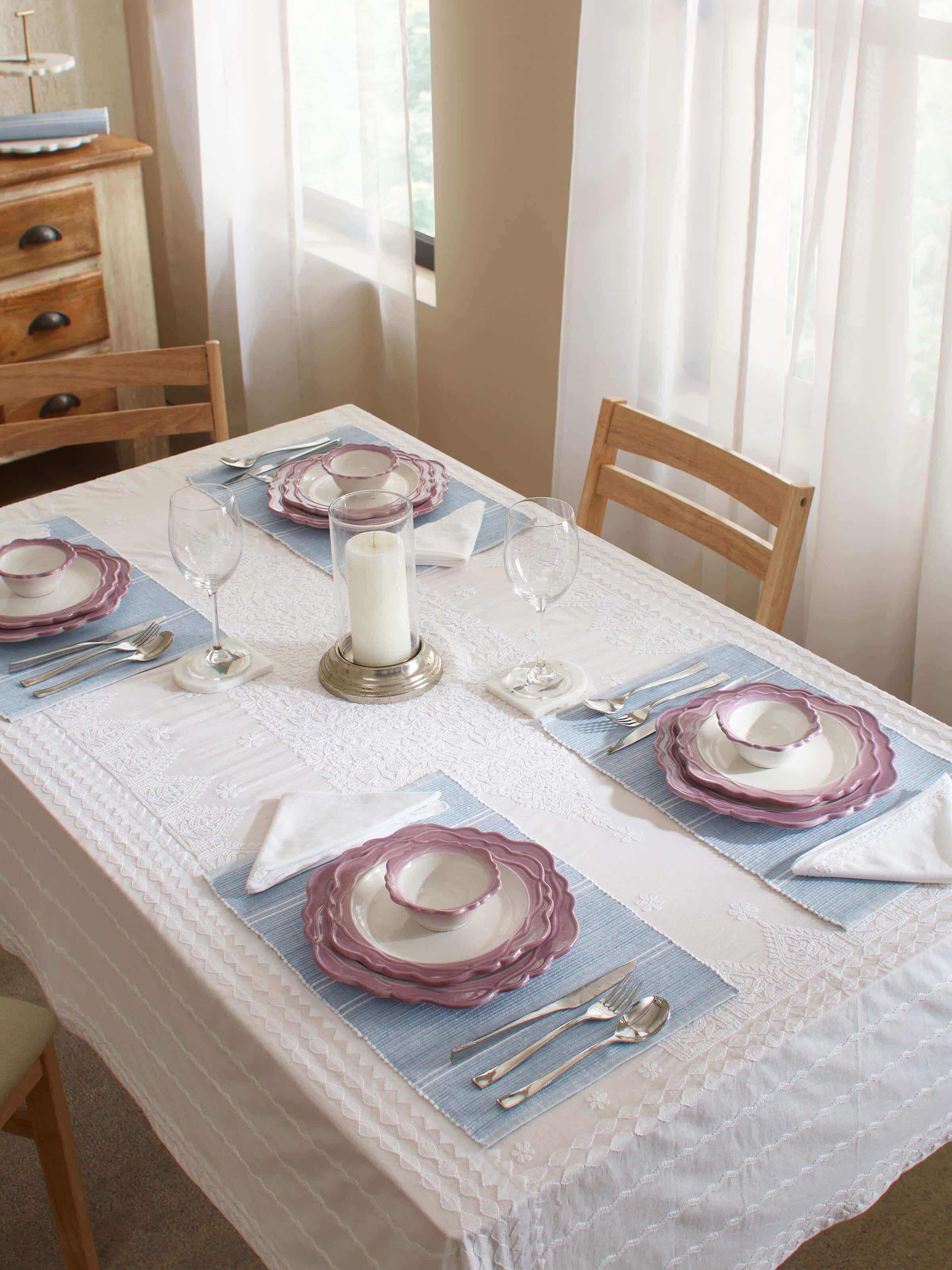 Detailed view of studio pottery ceramic dinner plates in pink (4 pcs) focusing on the craftsmanship.