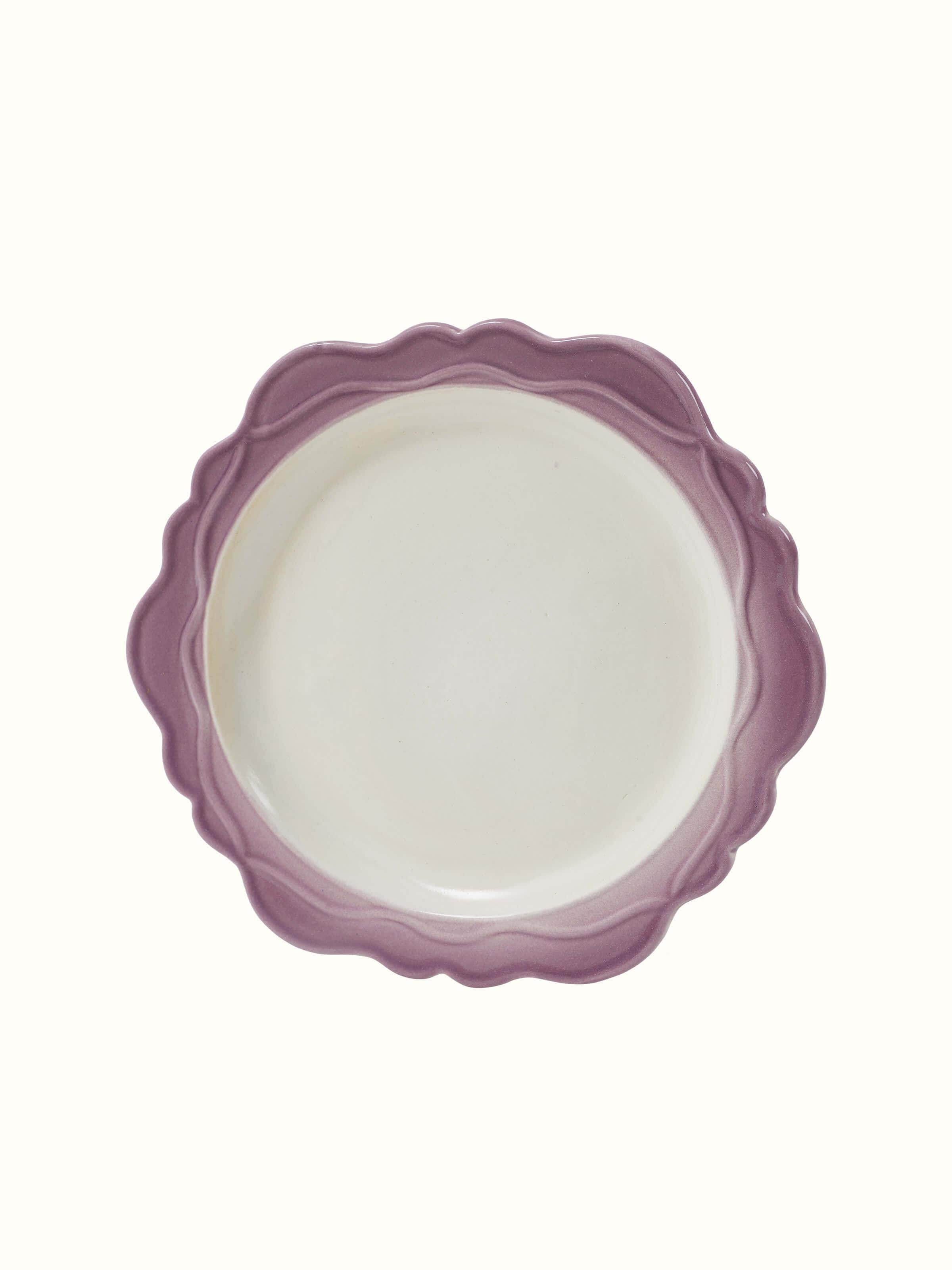 Side view of studio pottery ceramic dinner plates in pink (4 pcs) highlighting their elegant appearance.