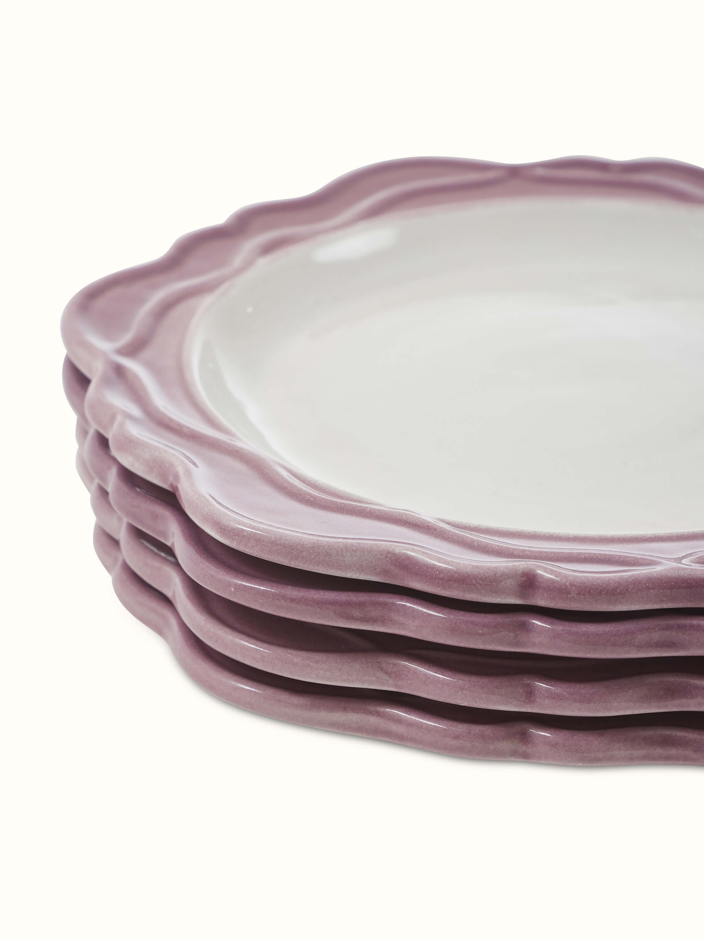 Angled view of studio pottery ceramic side plates white & pink set (4 pcs)