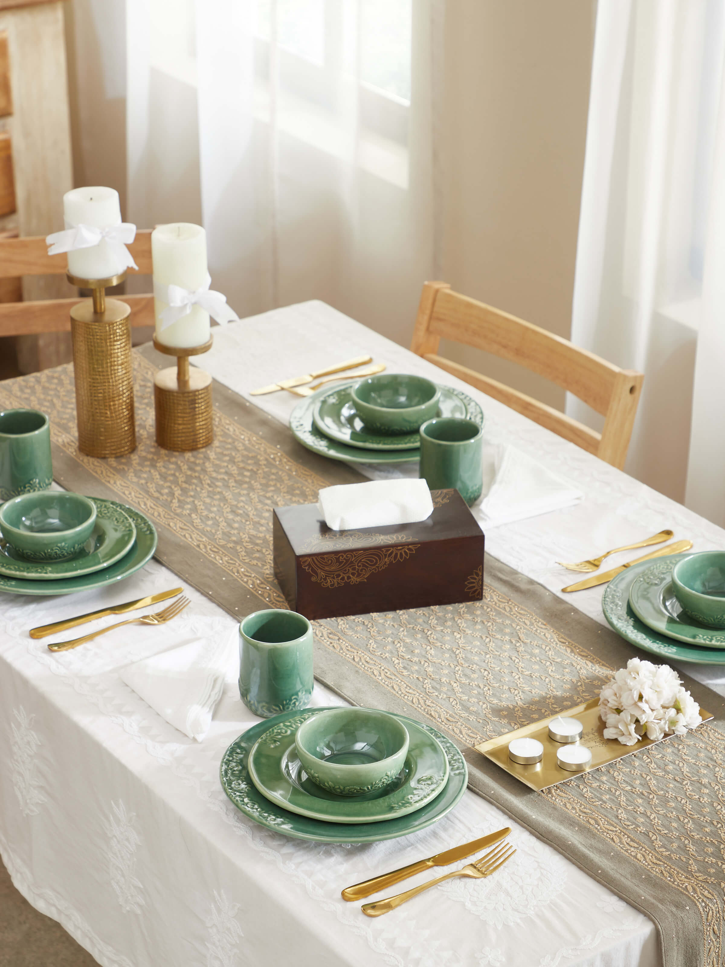 Close-up of Studio Pottery Ceramic Dinner Plates in green, focusing on the texture and quality of the ceramic