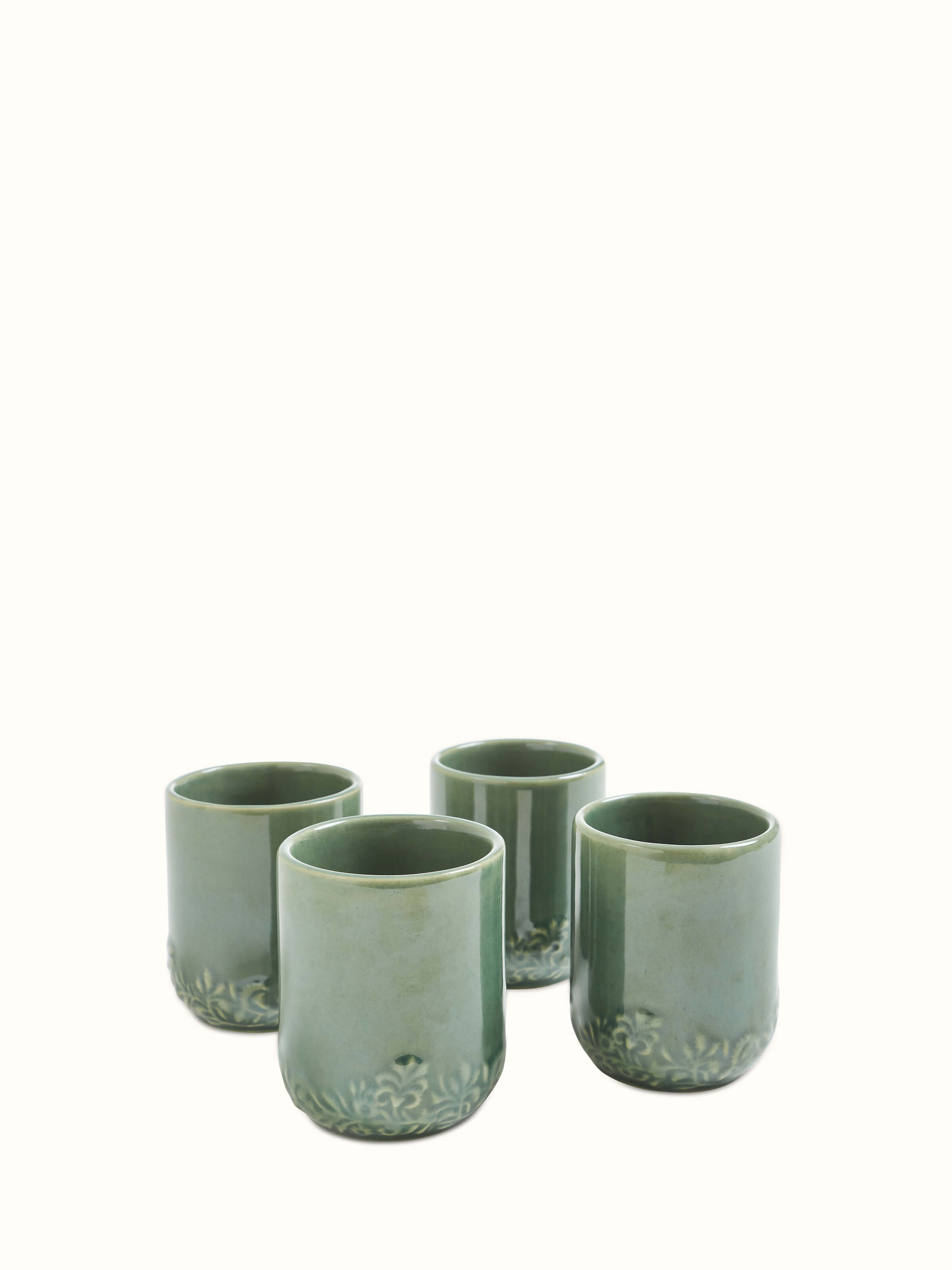 Front view of Studio Pottery Ceramic Water Tumblers in green, showing a set of four tumblers with a unique ceramic finish.